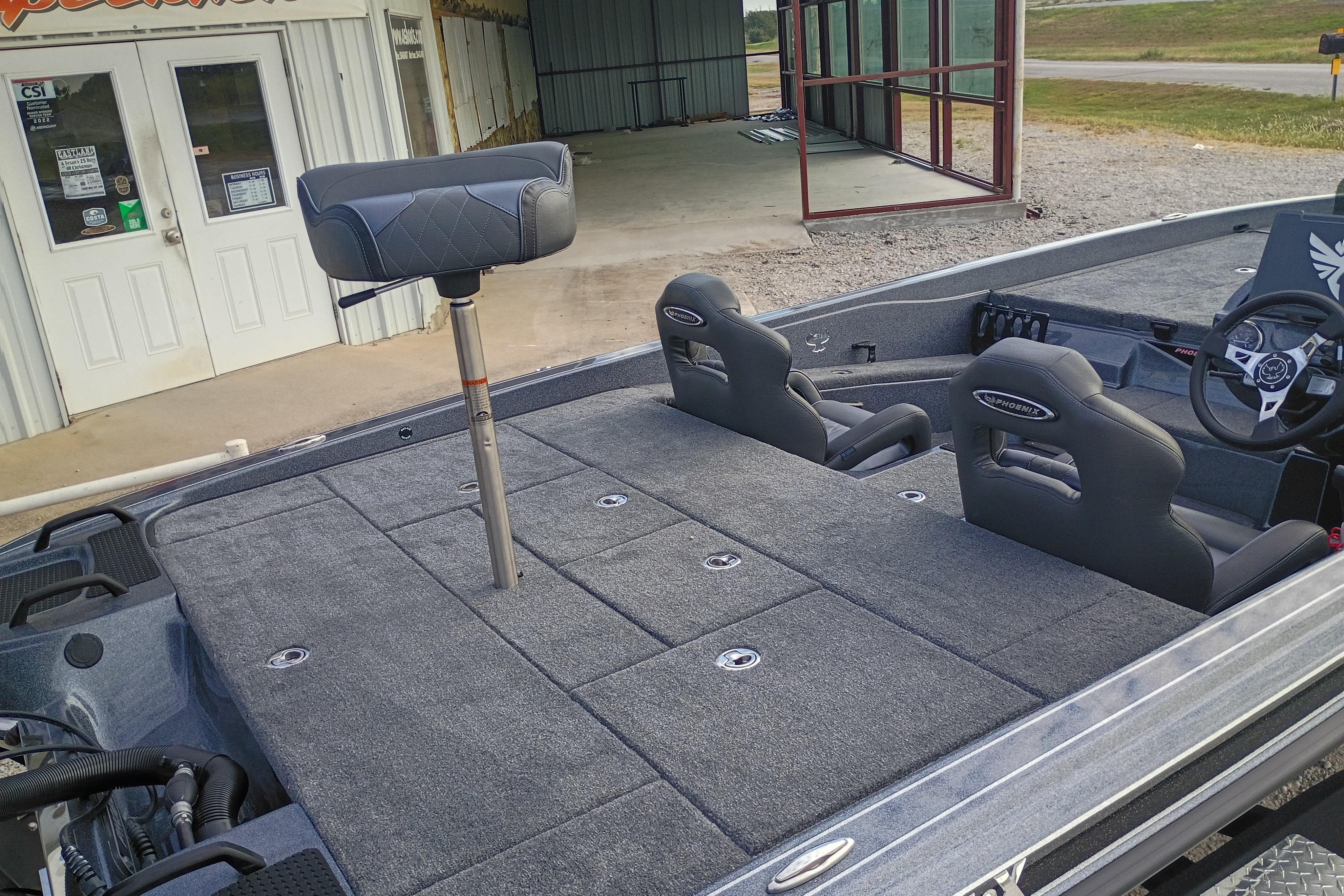 2026 Phoenix 921 ELITEX boat interior with spacious seating and modern steering wheel design.