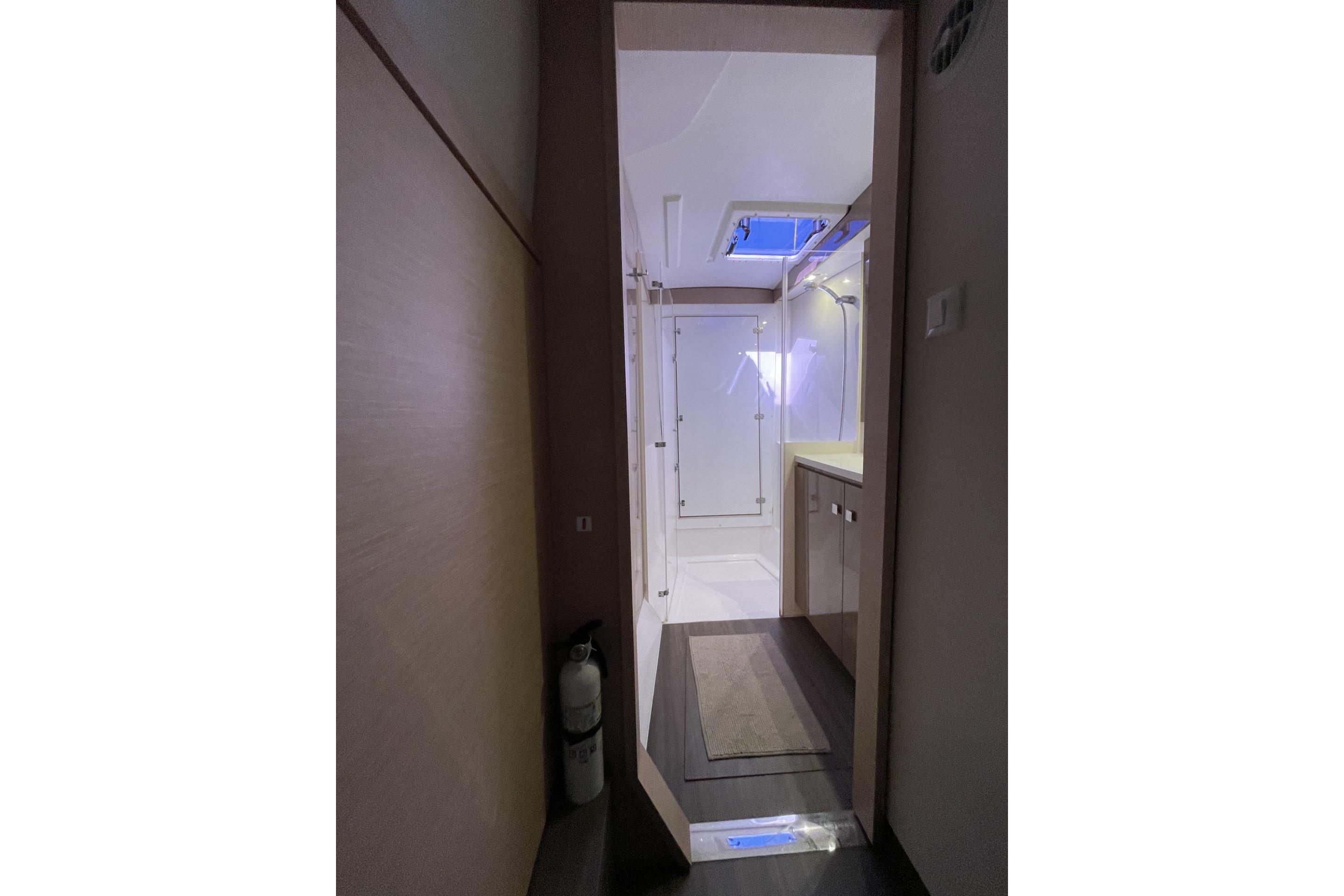 Interior view of 2019 Fountaine Pajot Lucia 40 yacht bathroom with modern fixtures.
