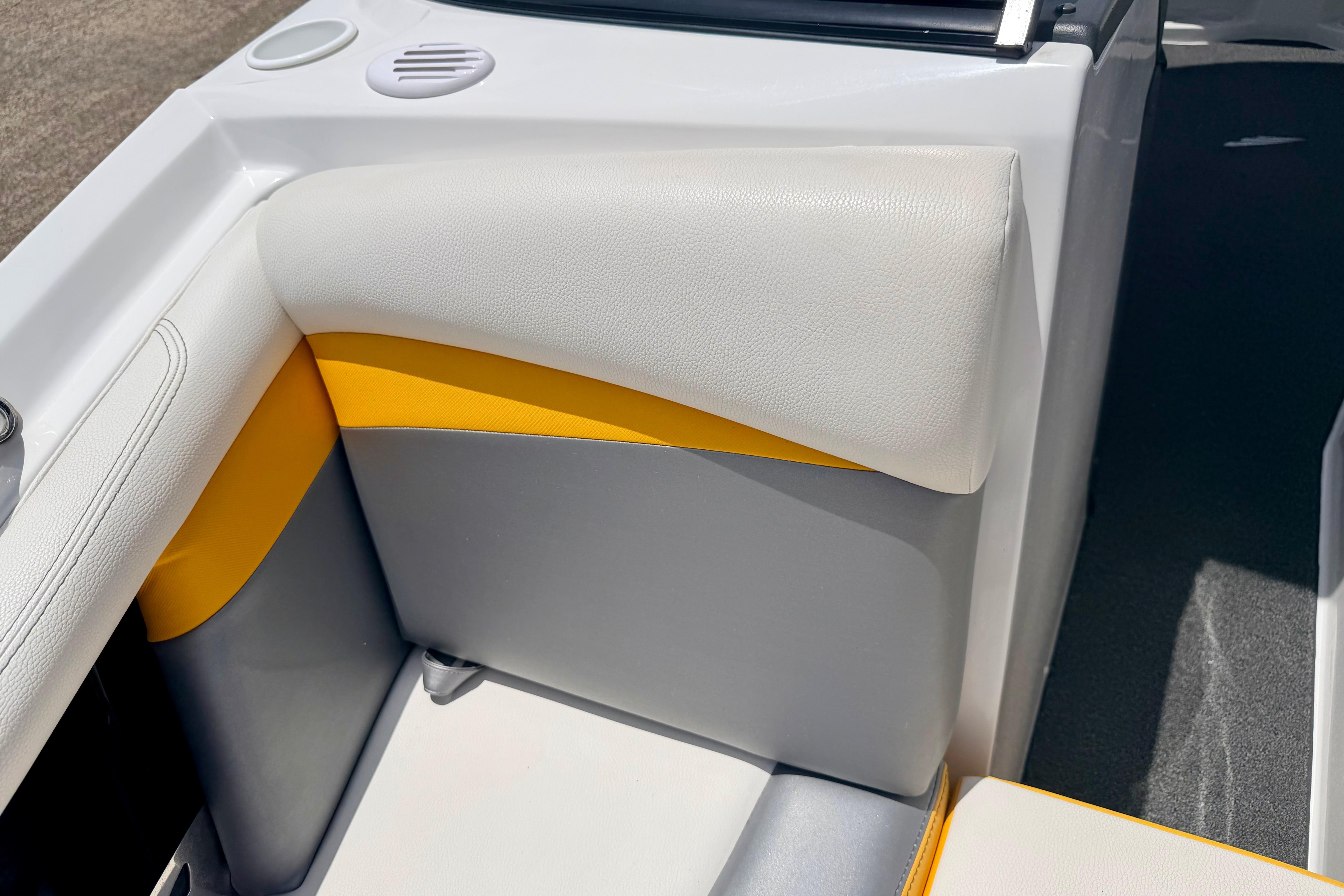 2014 Tigé R20 boat interior with white, gray, and yellow upholstery detail.
