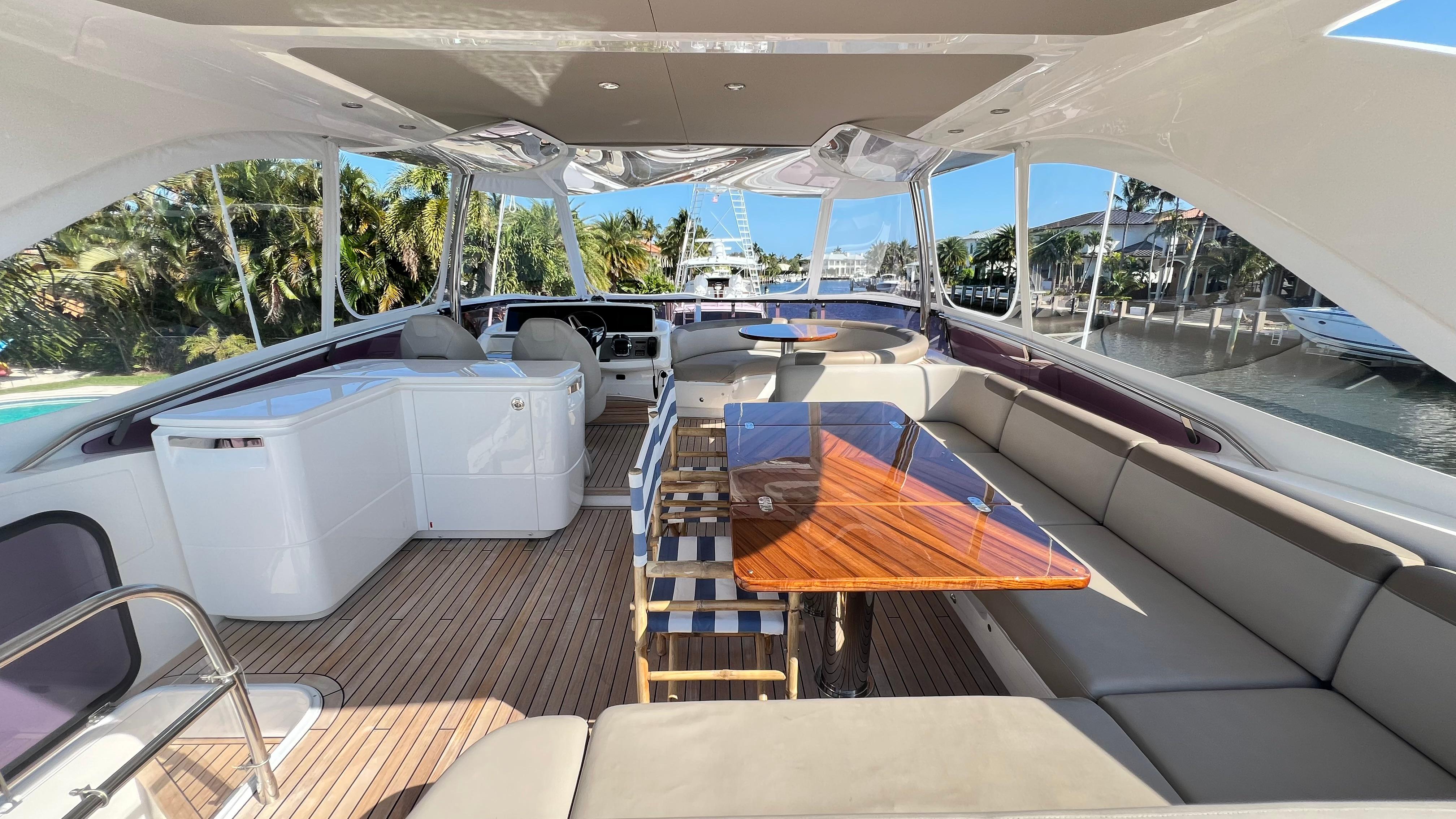 Luxurious 2019 Princess F62 yacht interior with elegant seating and wooden table.
