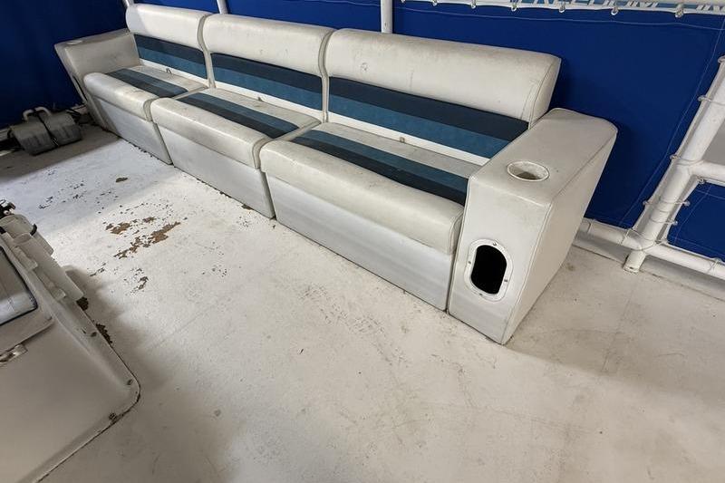 1993 Monark Sun Caster 240 CR 4 Point boat seating with blue and white upholstery.