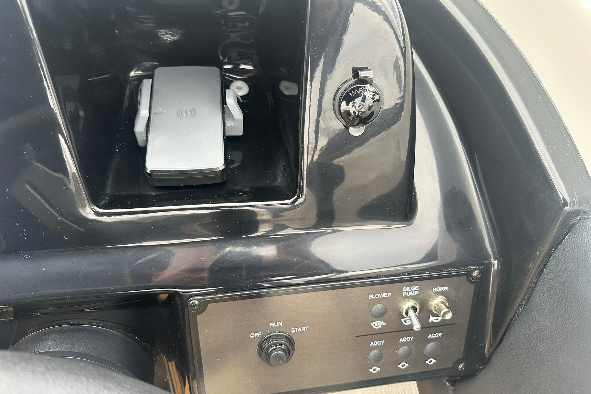 Control panel of a 2026 Bayliner V20 boat with ignition and accessory switches.