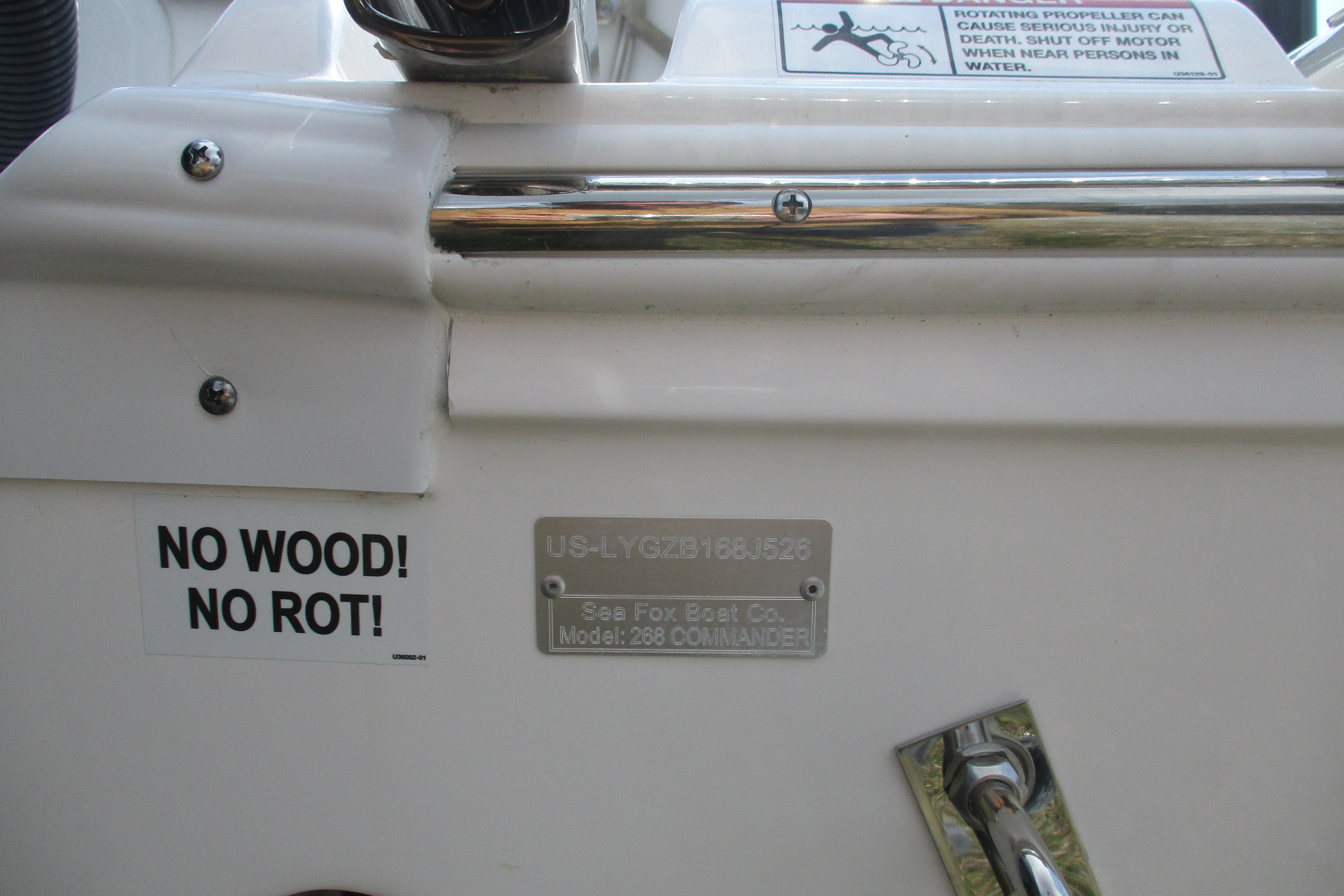2026 Sea Fox 268 Commander boat with "No Wood! No Rot!" label and safety warning.