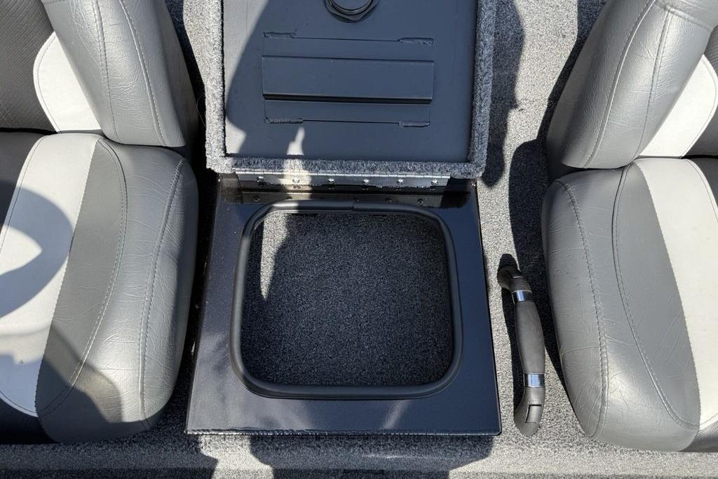 2023 Vexus AVX189 boat interior storage compartment between gray seats.