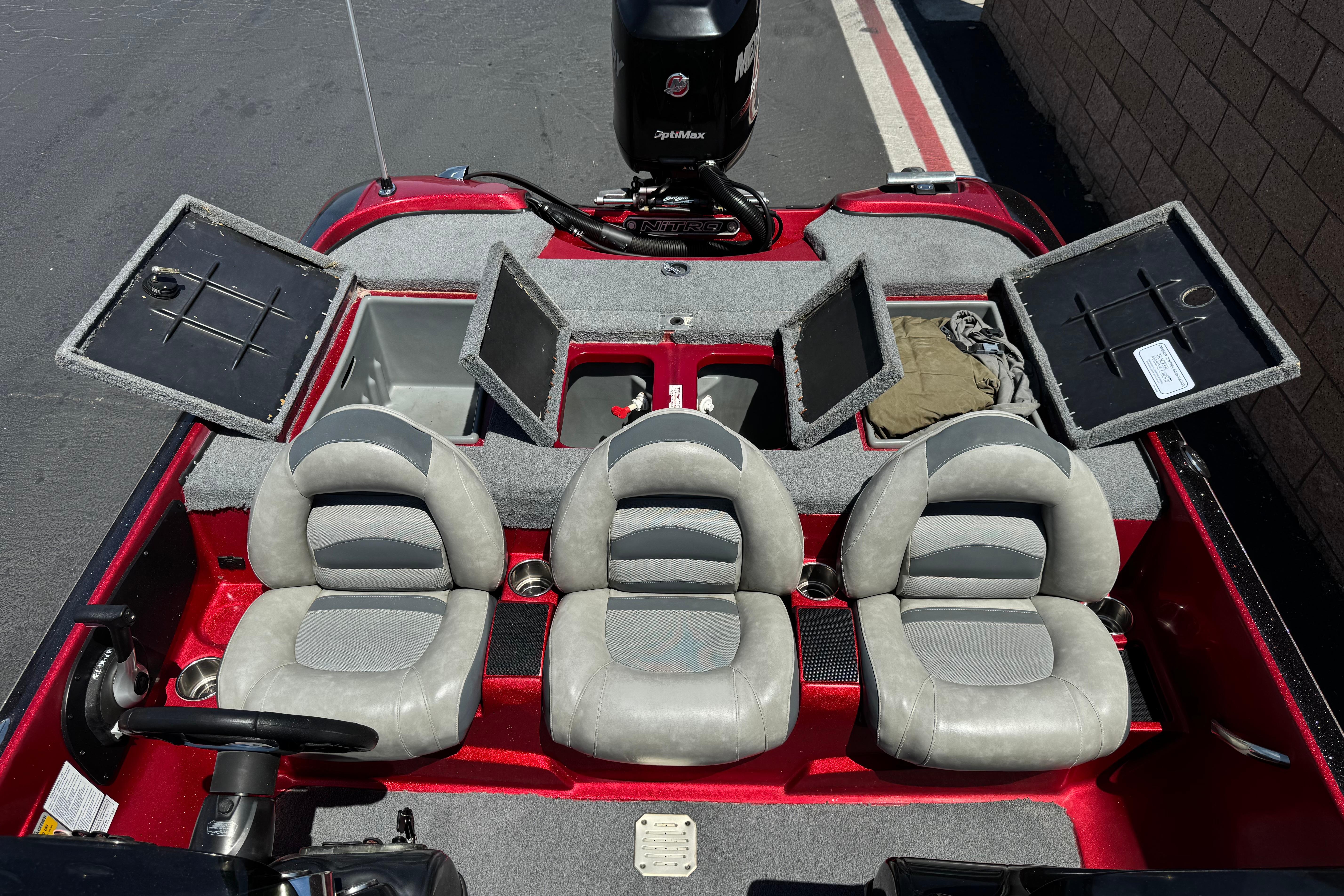 2012 Nitro Z-7 boat interior with three seats and open storage compartments.
