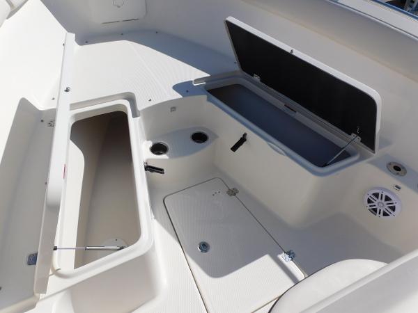 2024 Sailfish 242 CC boat storage compartments and seating area.