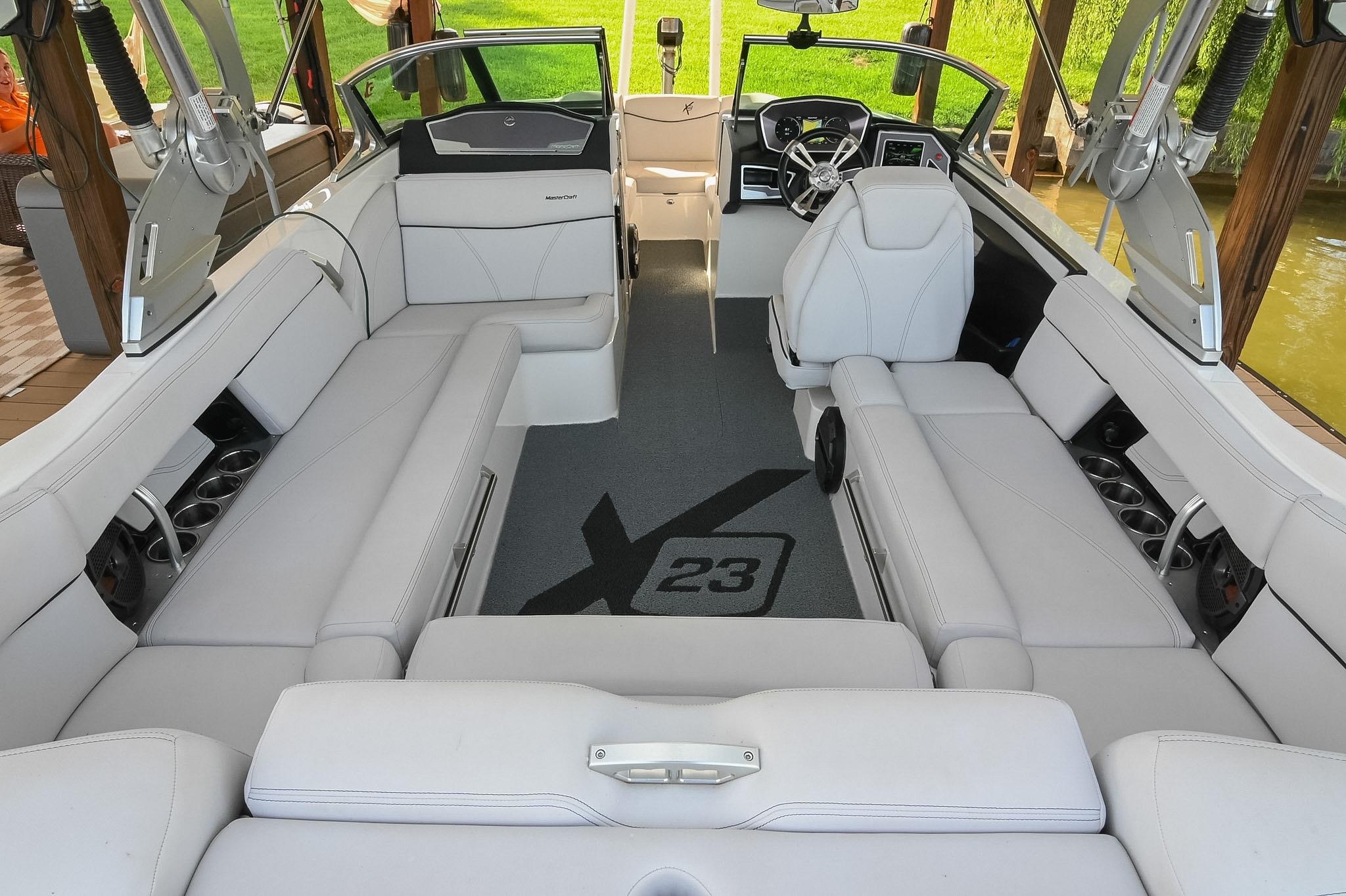 2018 MasterCraft X23 boat interior with luxurious seating and modern dashboard design.