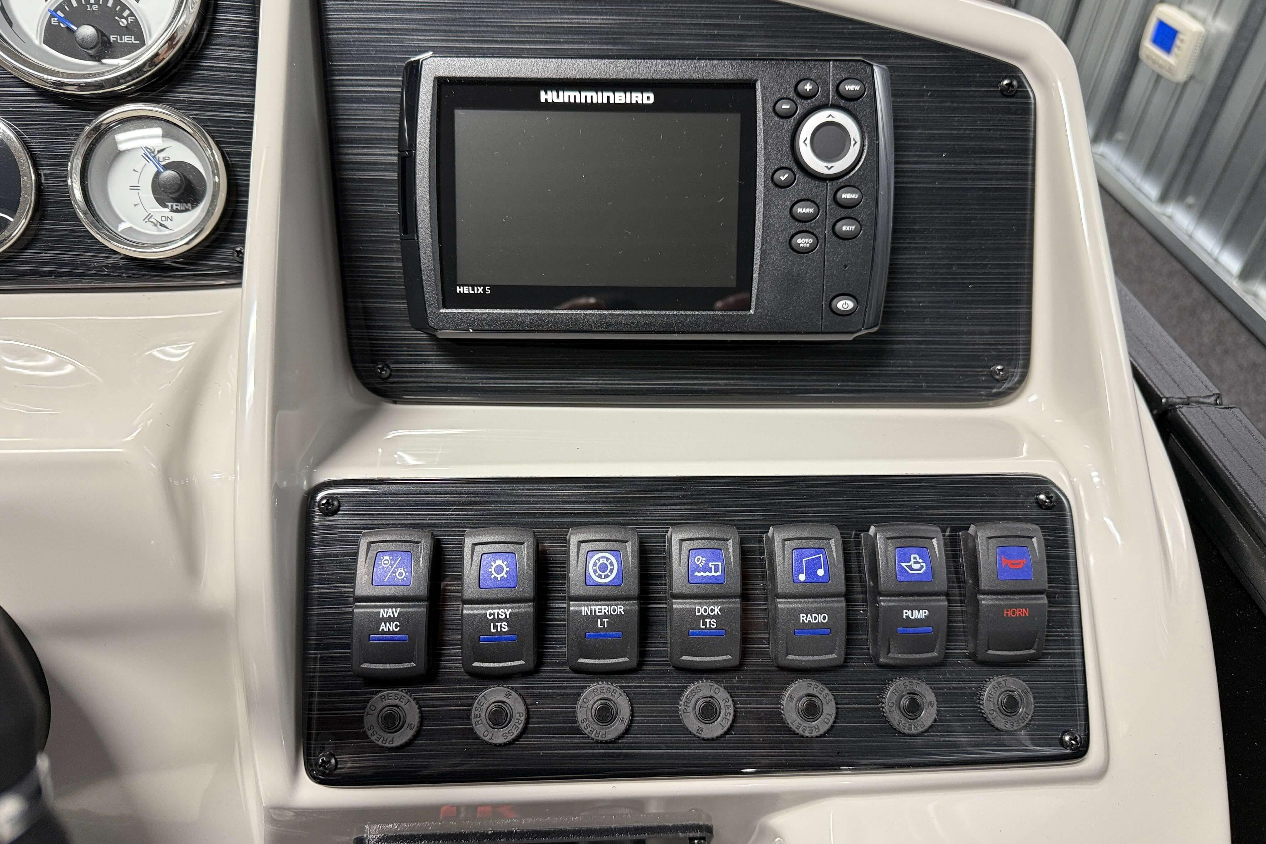 Control panel of 2026 Sylvan Mirage X1 boat with Humminbird Helix 5 display.