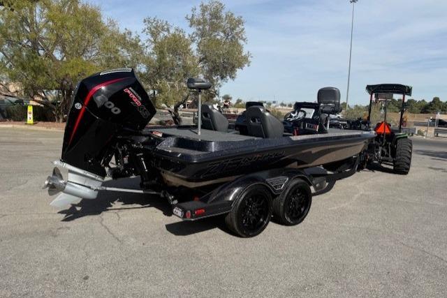 2026 Nitro Z19 XL Pro boat with powerful engine, parked on a trailer in a sunny lot.
