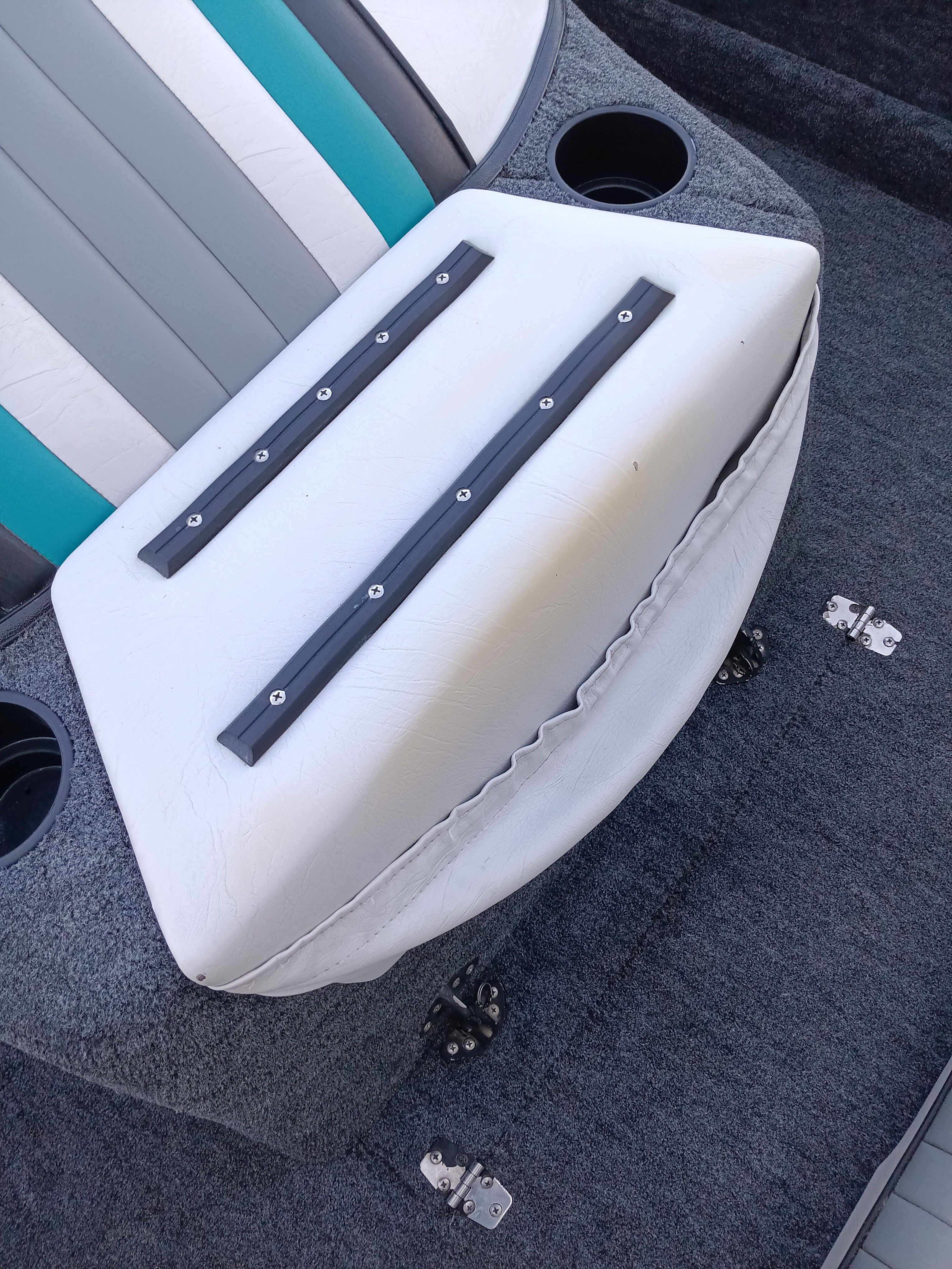Interior of a 1991 Malibu Skier boat with seat cushion.