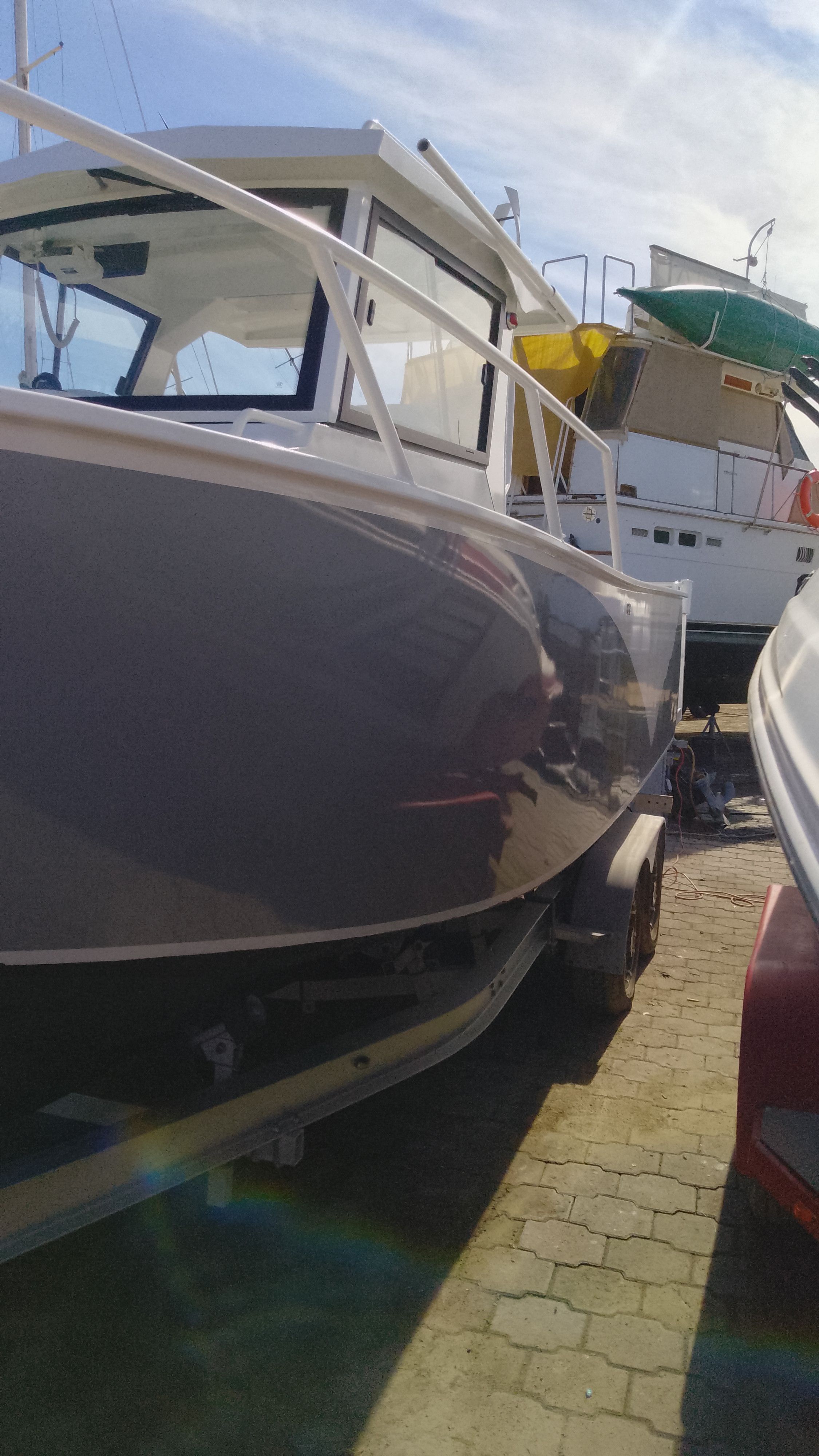 Gospel Boat 7.5M 2024 parked on a trailer outdoors.