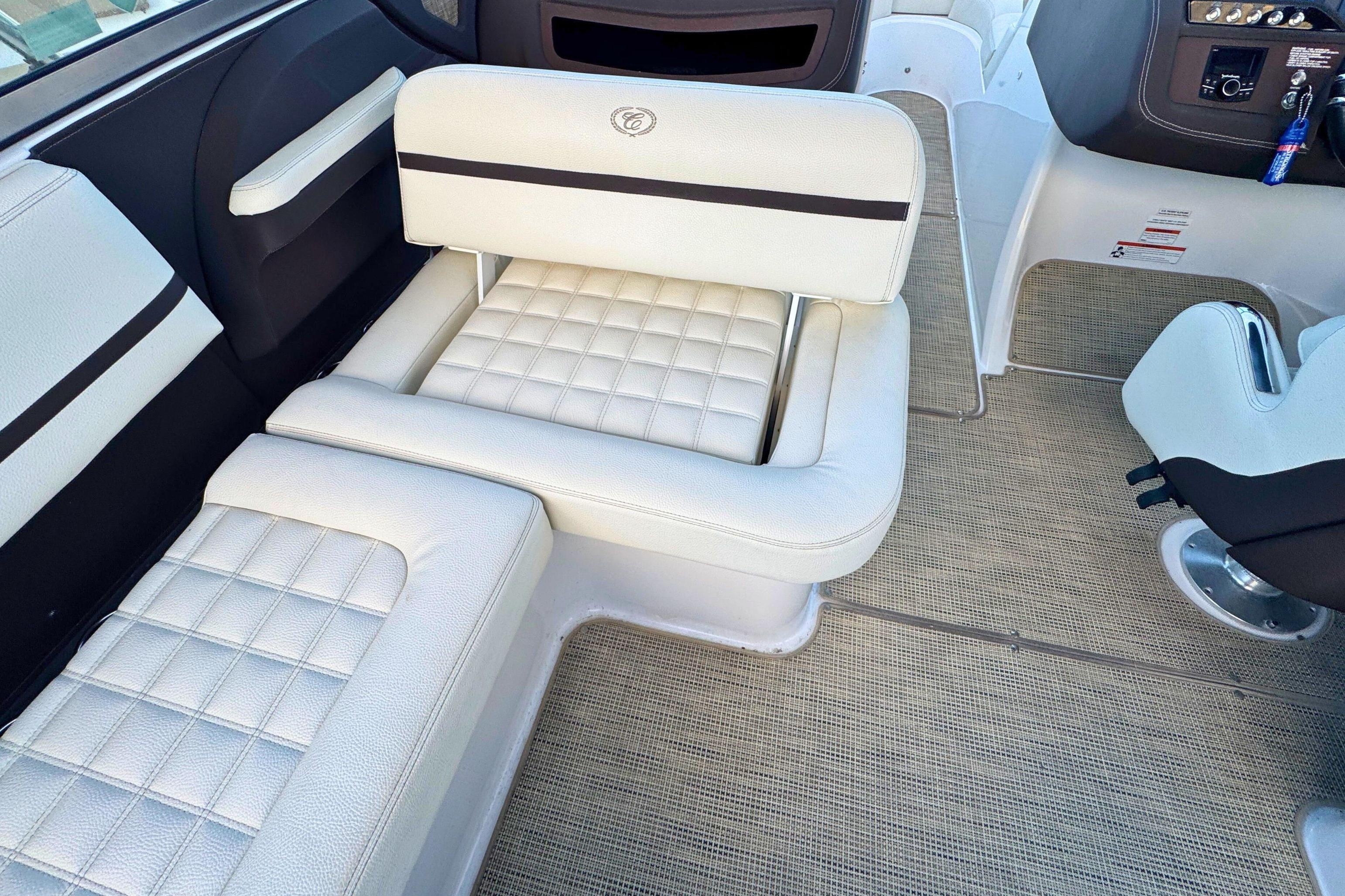 2019 Cobalt R3 boat interior with white cushioned seating and modern dashboard.