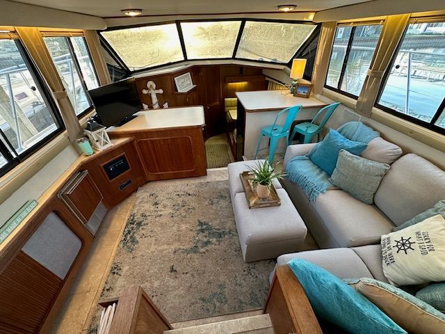 Interior of 1988 Carver 3807 Yacht with cozy seating area.