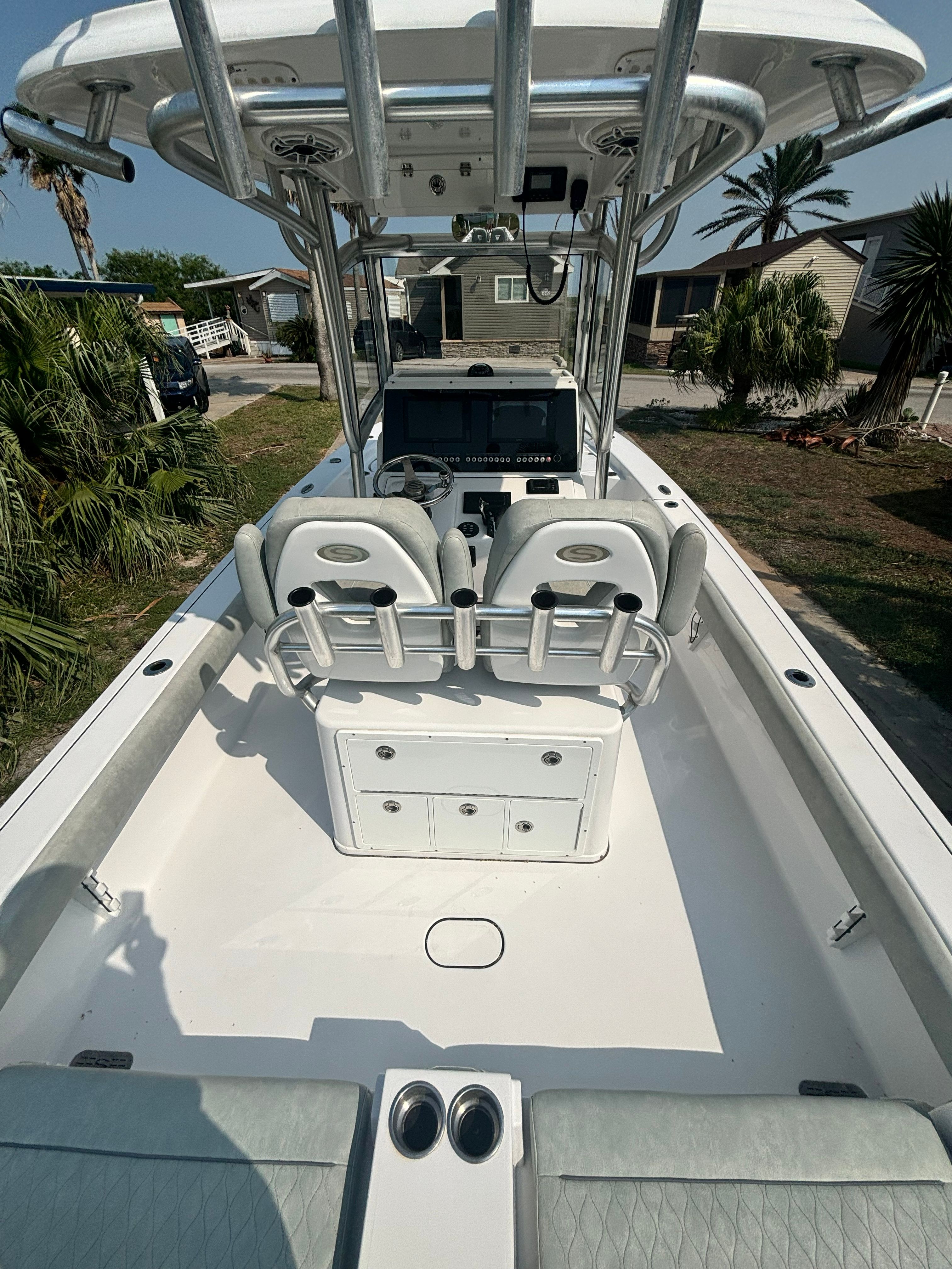 The image shows the cockpit of a 2019 Sportsman Masters 267 Bay Boat with gray seating.