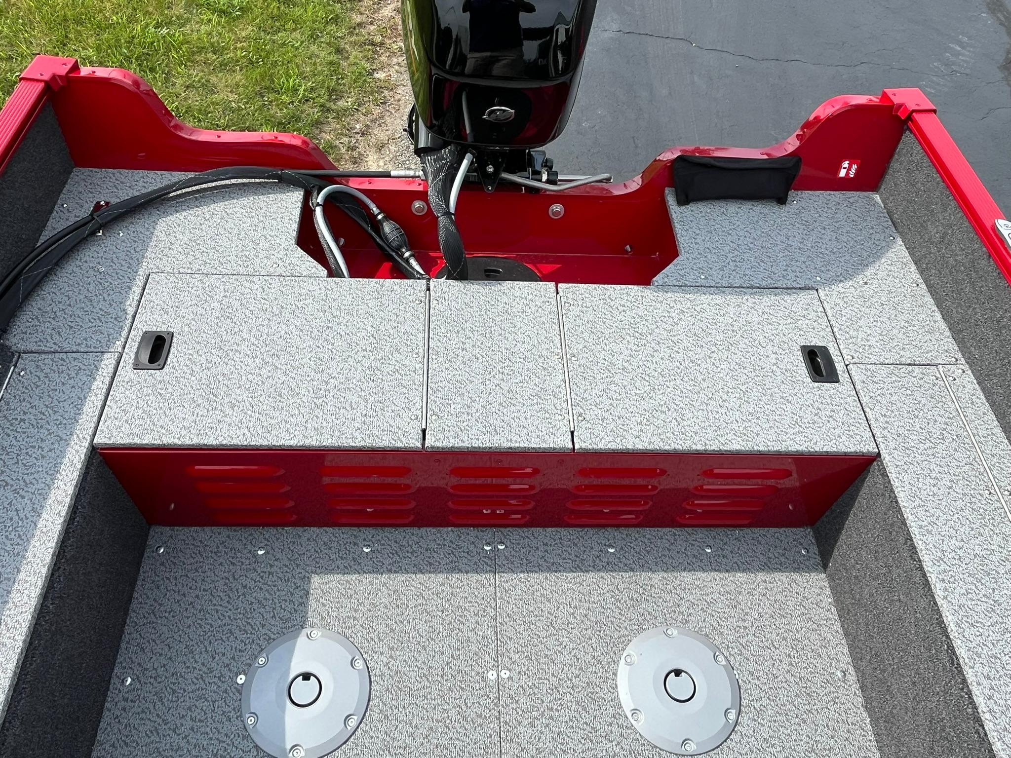 2026 Lund 1650 Angler SS boat interior with red accents and motor.