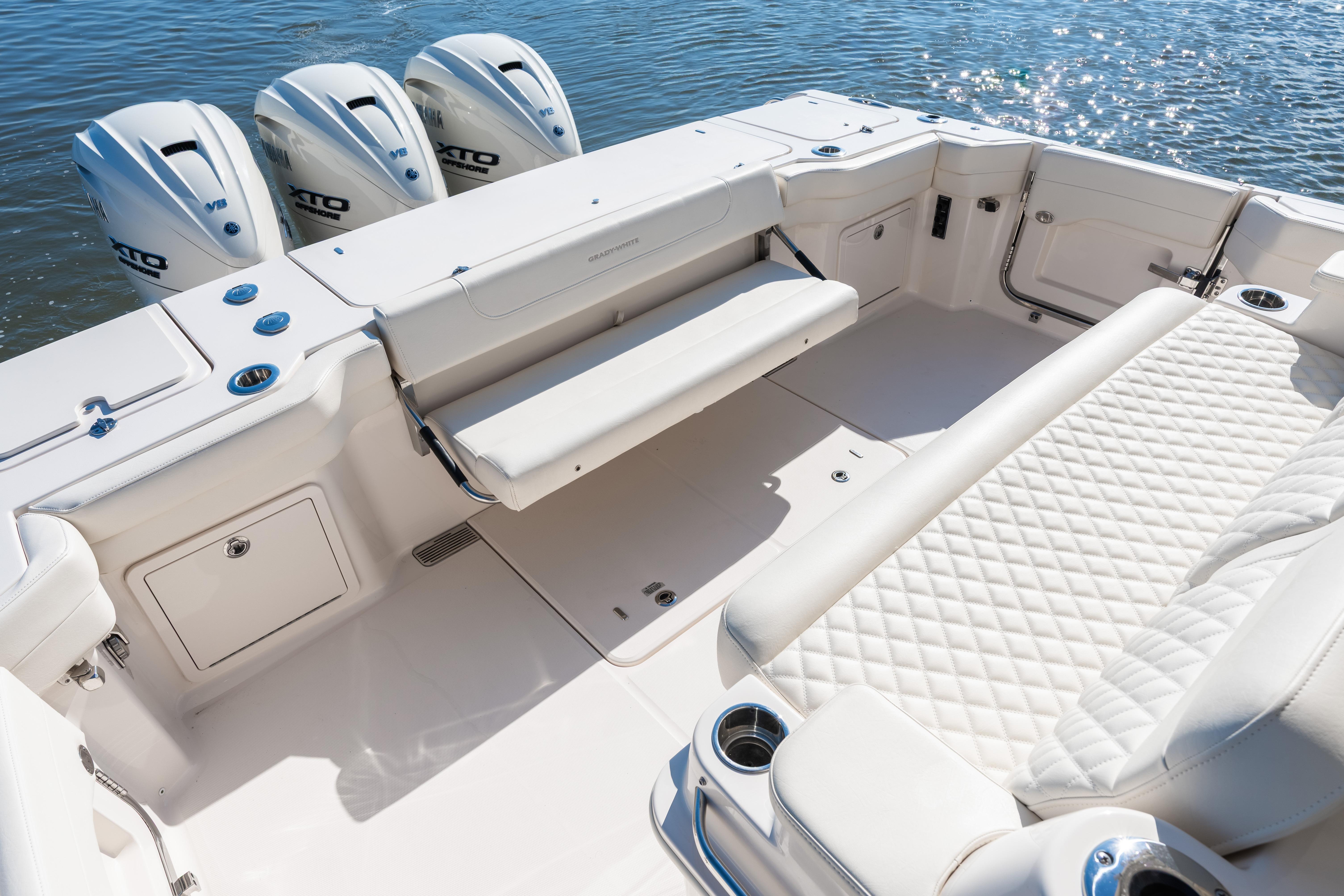 2025 Grady-White Canyon 386 boat interior with luxurious seating and triple outboard engines.