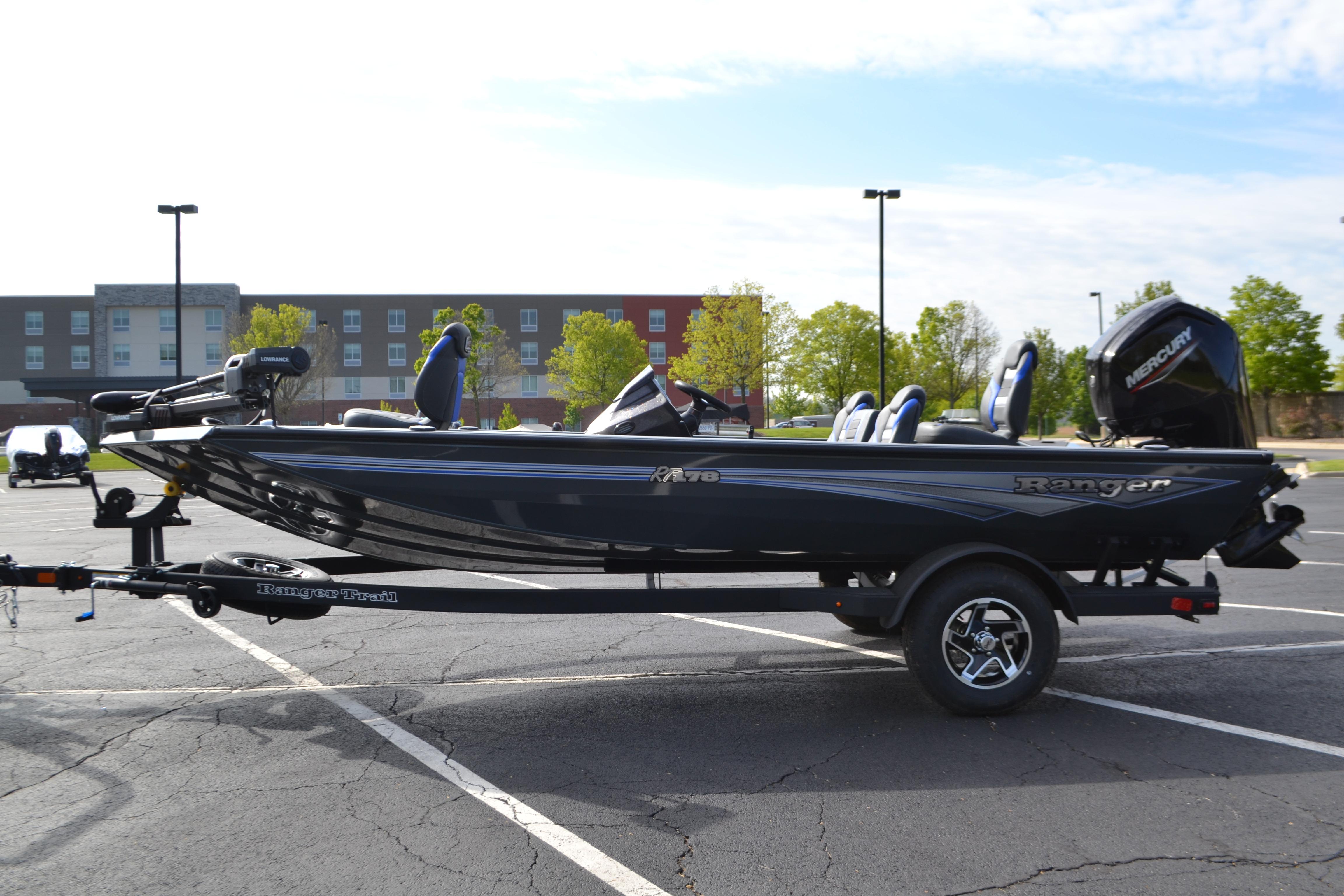 2026 Ranger RT178 boat on trailer in parking lot, side view.
