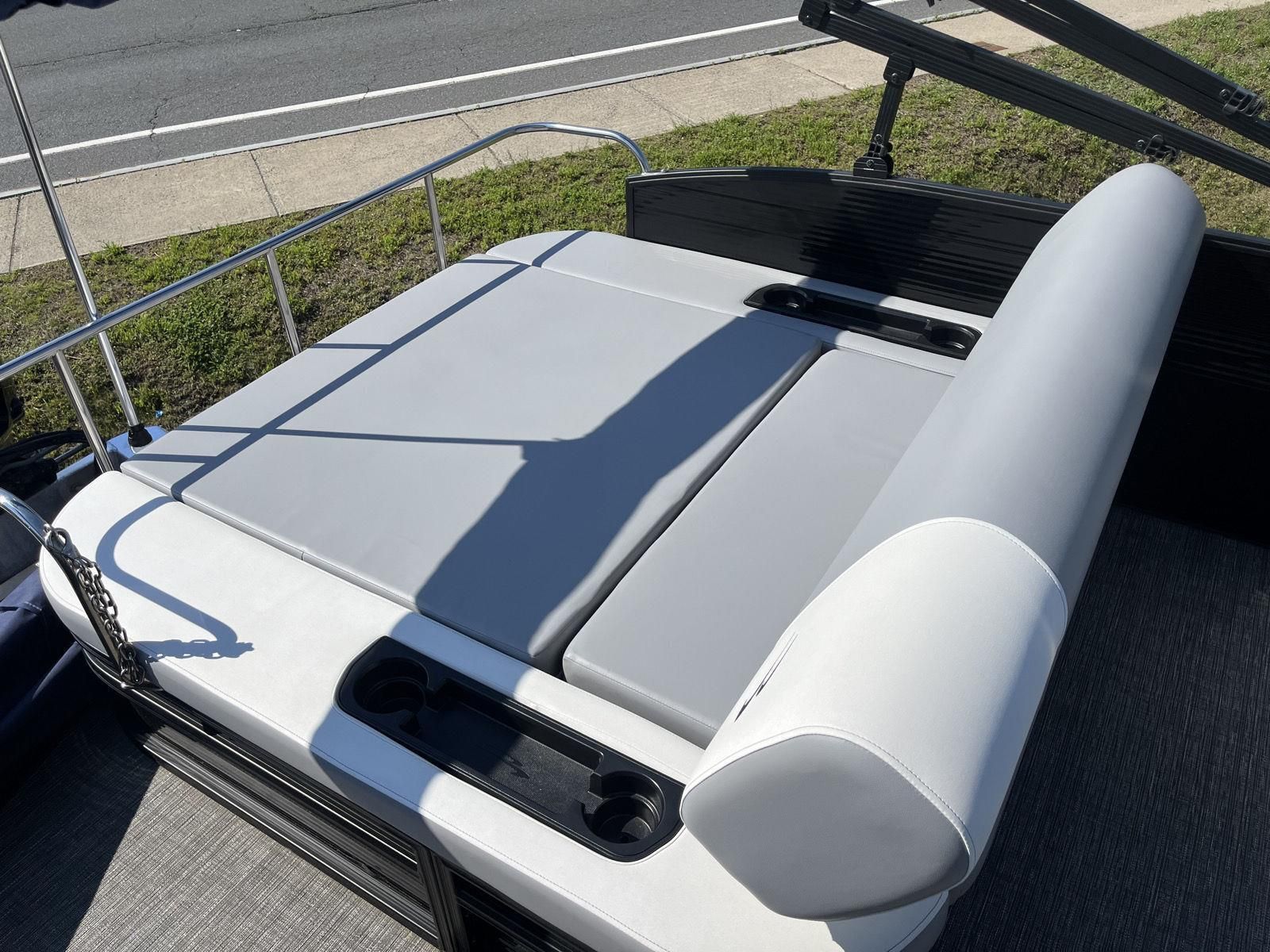 The image shows a gray and white lounging area on a 2025 Bennington S20 boat.