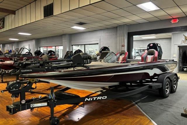 2026 Nitro Z20 XL Pro bass boat displayed indoors, featuring sleek design and advanced Garmin technology.