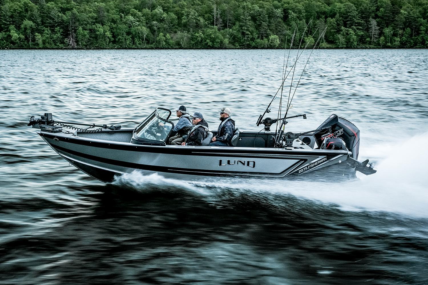 Manufacturer Provided Image: 2025 Lund 2075 Fisherman boat speeding on a lake with anglers onboard.