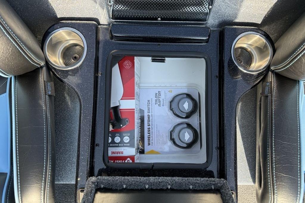 Interior of 2026 Phoenix 20 XE with storage compartment and cup holders.