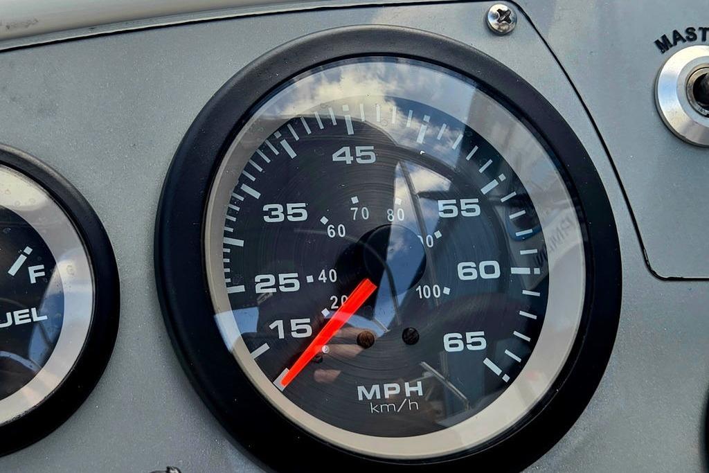 Close-up of a 2018 Tahoe 450 TS speedometer, displaying speed in MPH and km/h.
