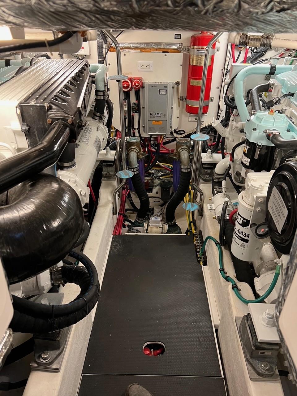 Engine room of 2005 Tiara Yachts 4200 Open, showcasing mechanical components and systems.