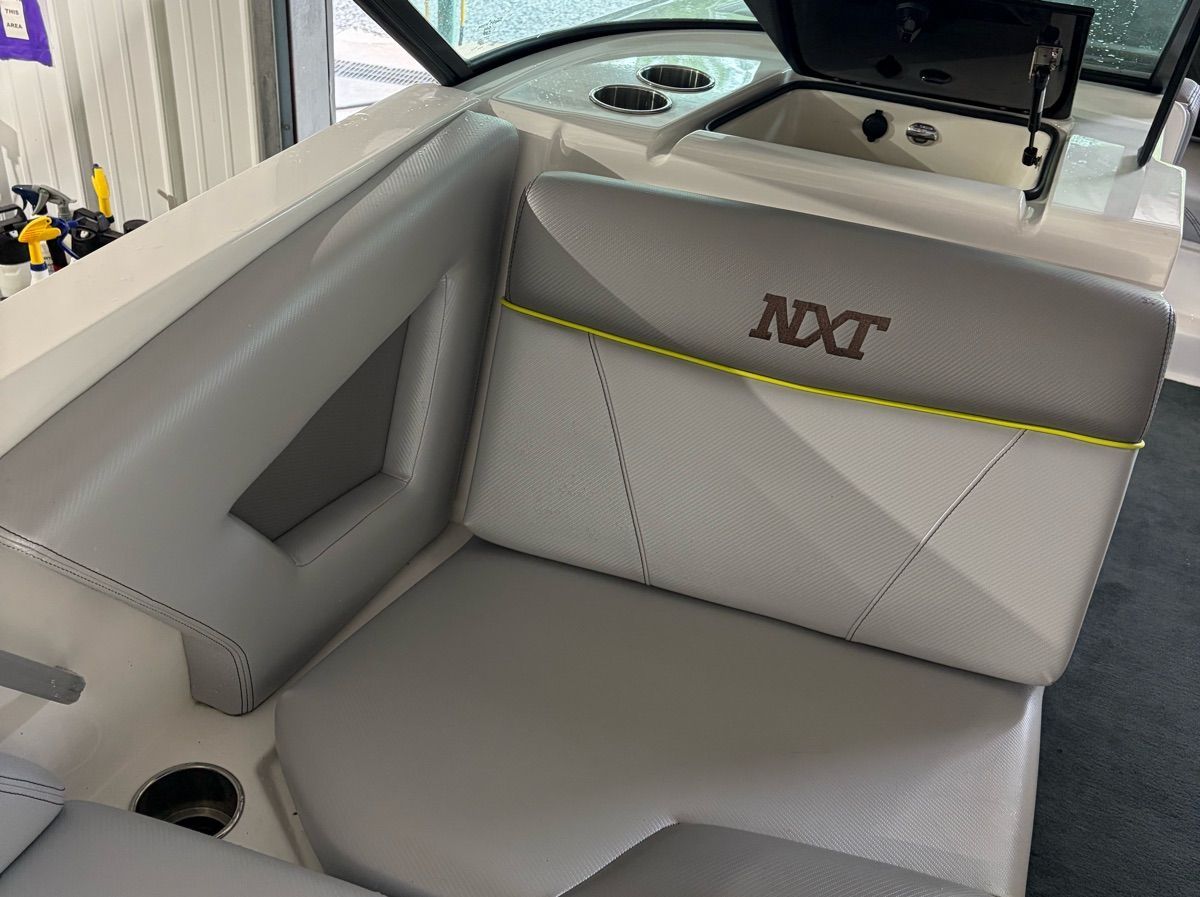 Interior of a 2017 MasterCraft NXT22 with gray upholstery and NXT logo.