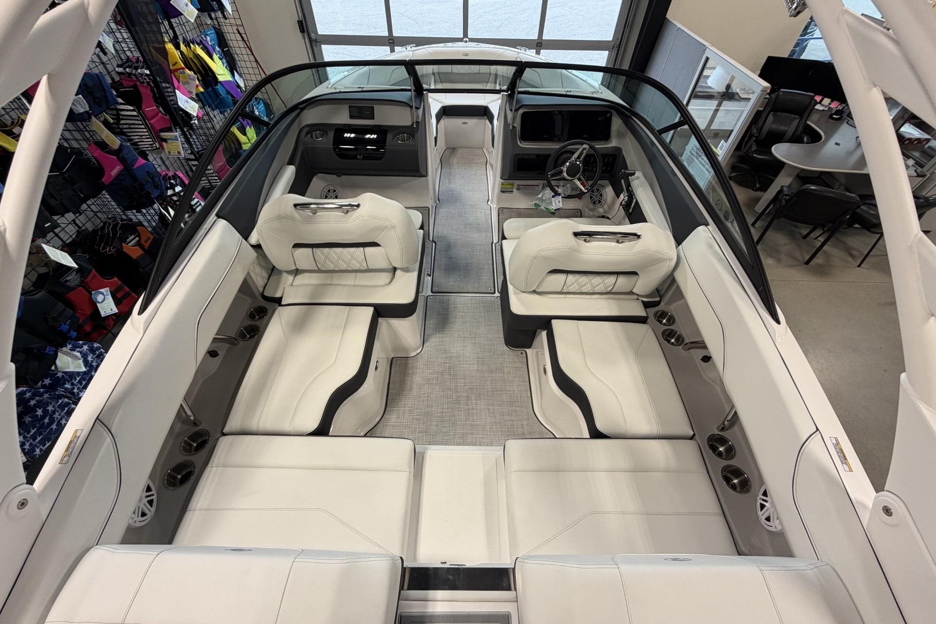 Luxurious interior of 2027 Regal LS2 boat with white seating and modern dashboard.