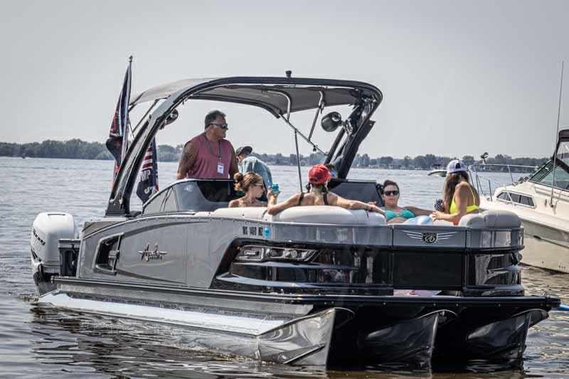 Avalon 2785 EXCALIBUR boat with passengers on water, year 2020.