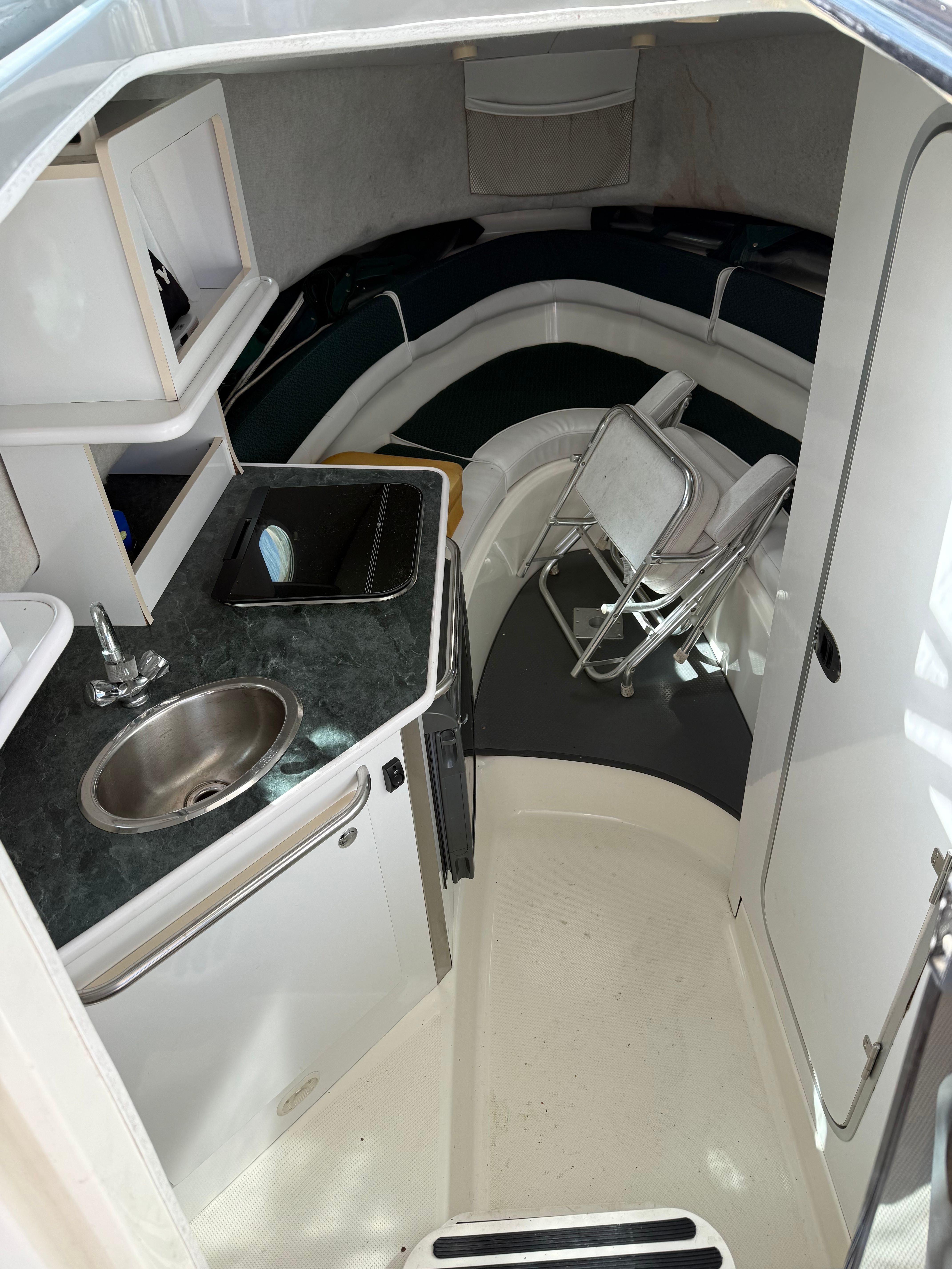 Interior of 2005 Trophy 2902 Walkaround with kitchenette and seating area.