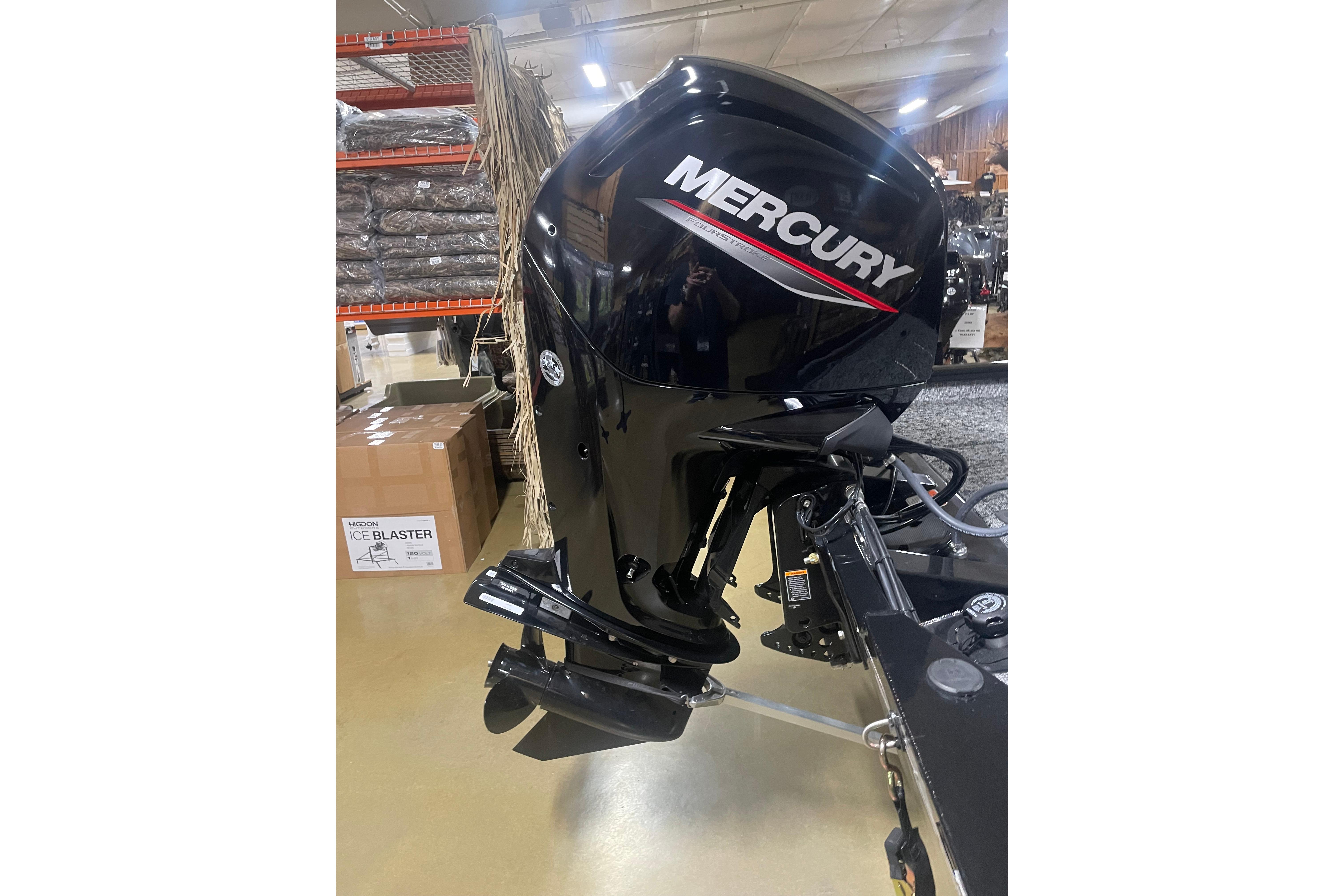 Mercury outboard motor on 2026 Tracker Pro Team 175 Crappie Edition boat in showroom.
