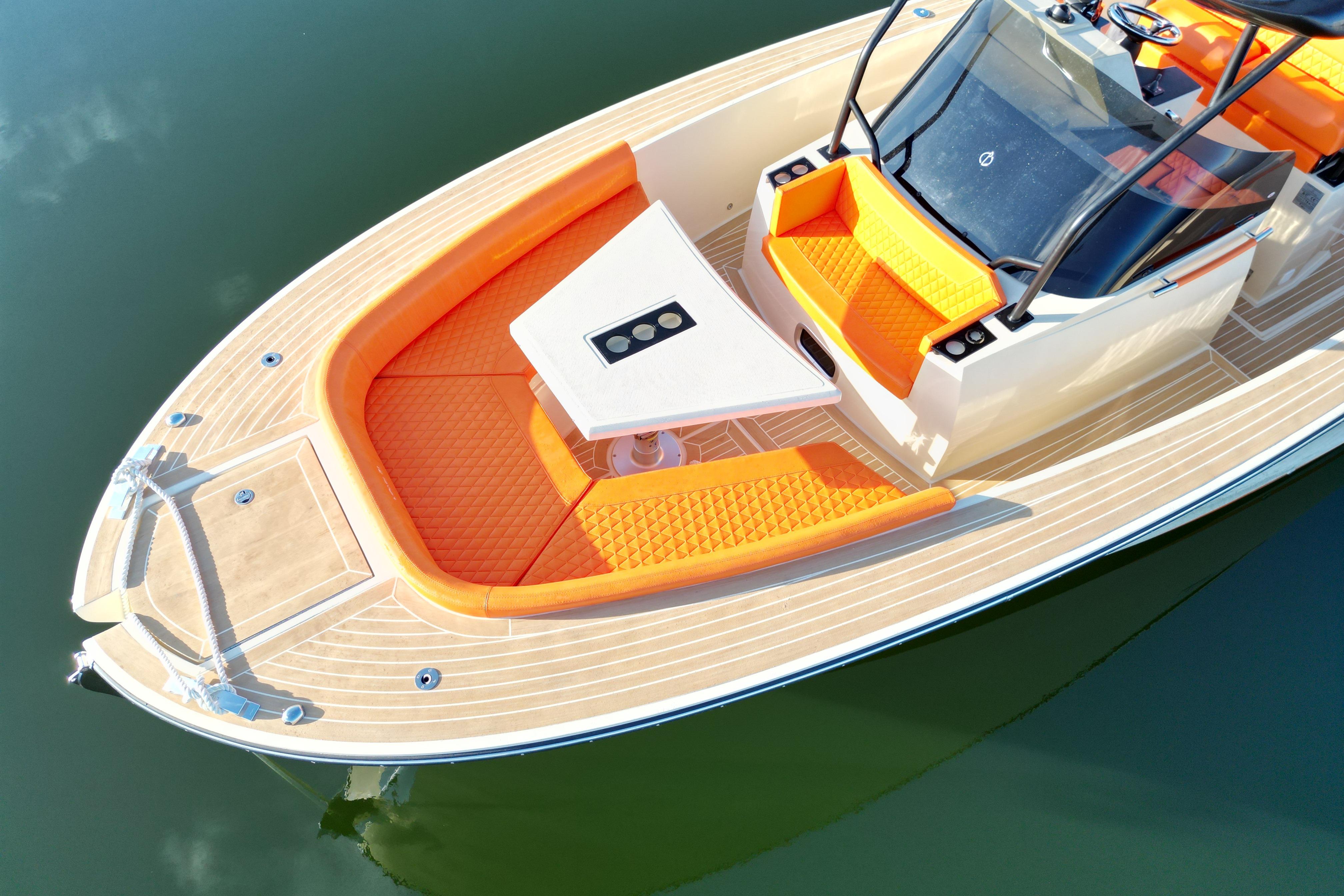2026 Lilybaeum Lipari 31 boat with orange seating and sleek design on calm water.