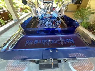 A 1980 Sanger HYDRO V DRIVE with a prominent engine and "RESURRECTION" lettering.