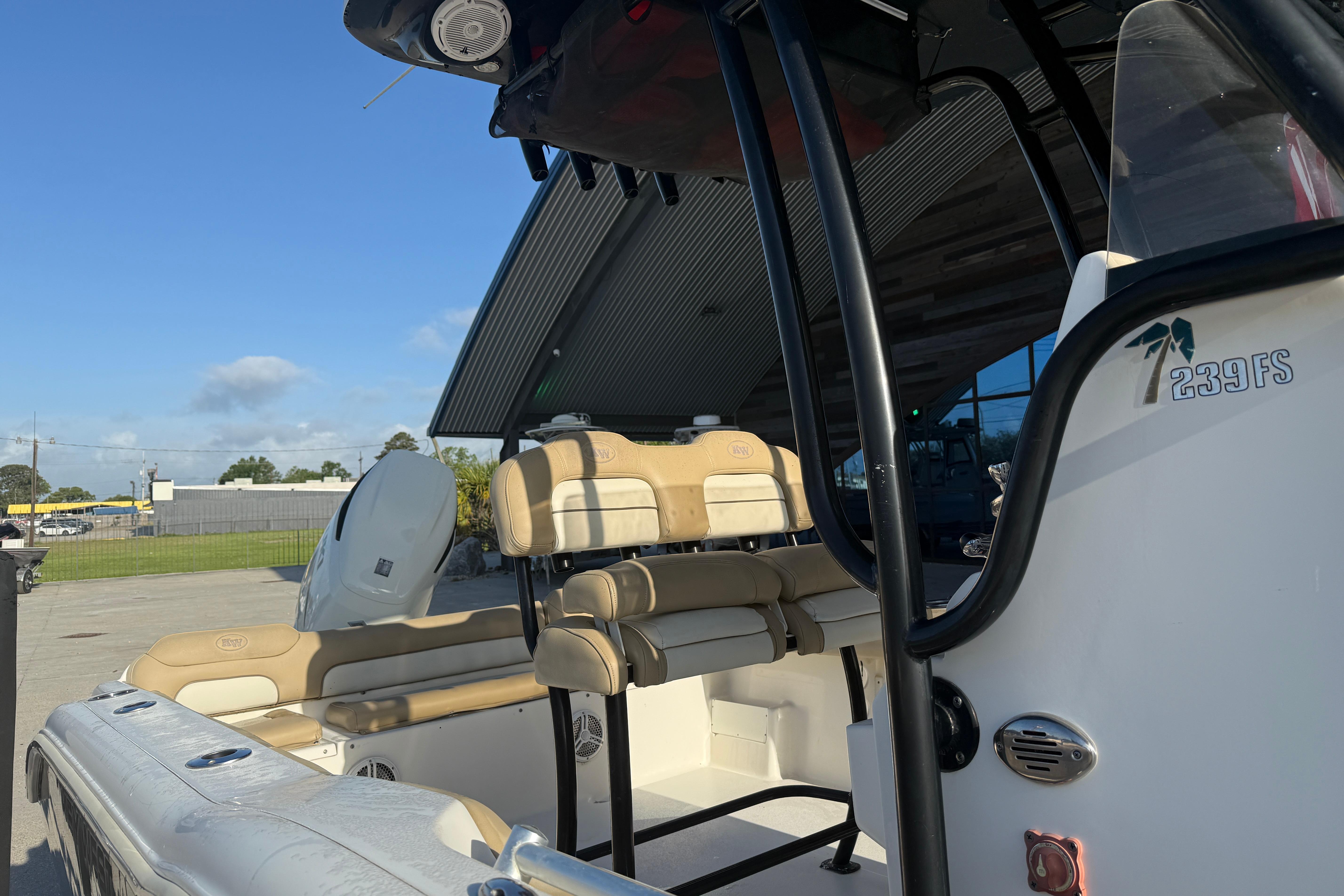 2016 Key West 239 FS boat interior with seating and console details.
