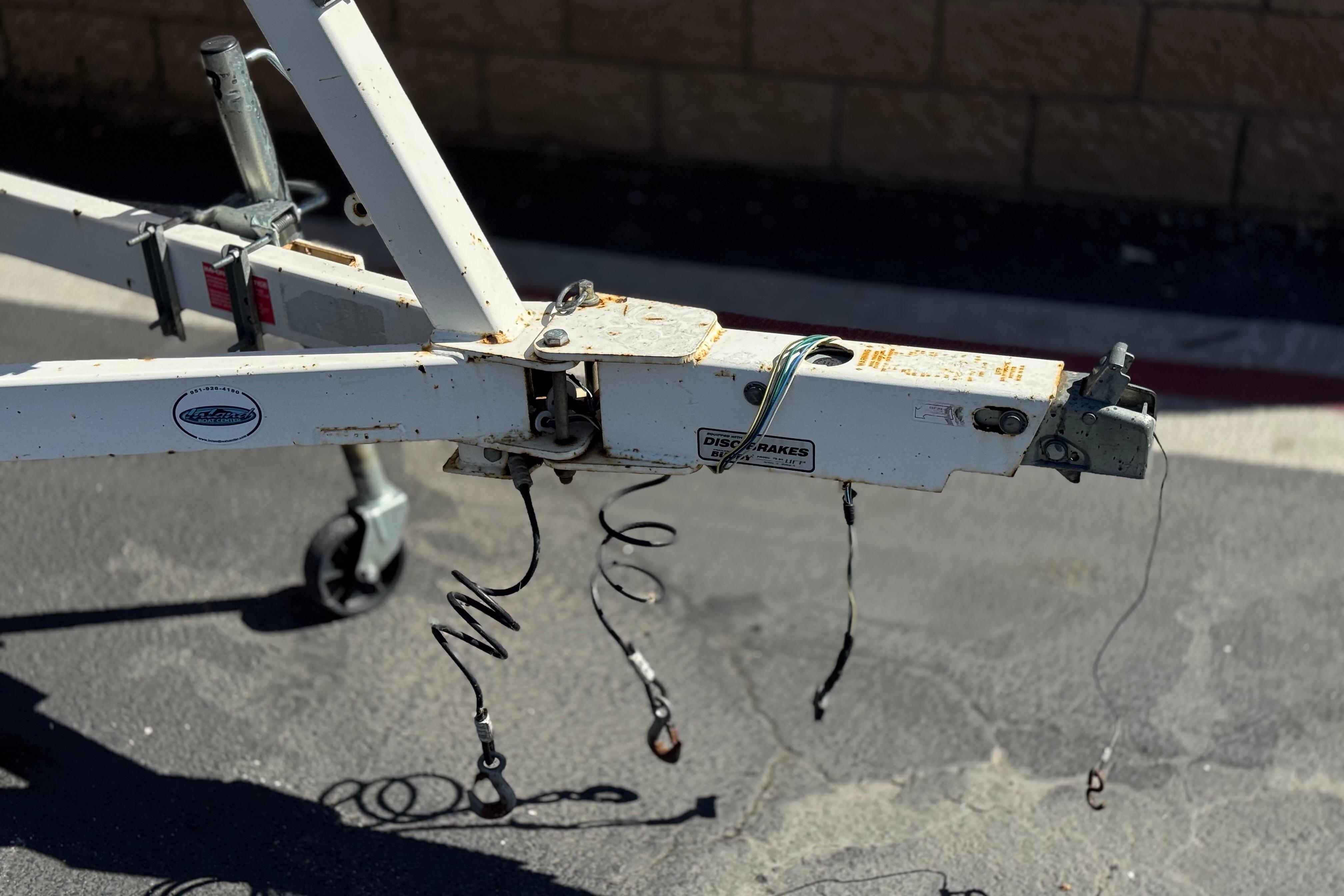 Trailer hitch of a 2002 Chaparral 186 SSi boat, showing rust and wear.