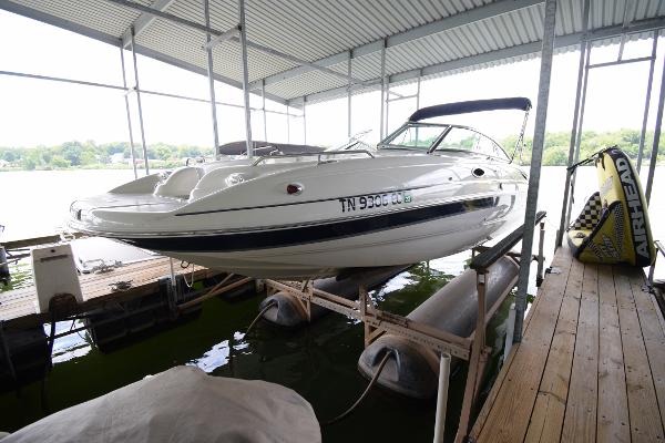 A 2010 Bryant 255 boat is in a covered dock.