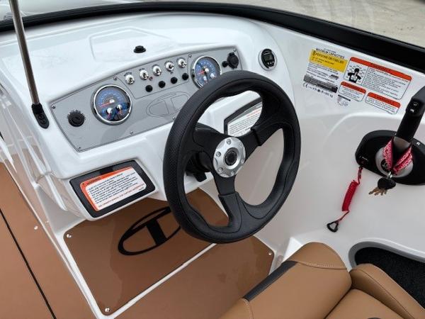 2025 Tahoe 185 S boat dashboard with steering wheel and control panel.