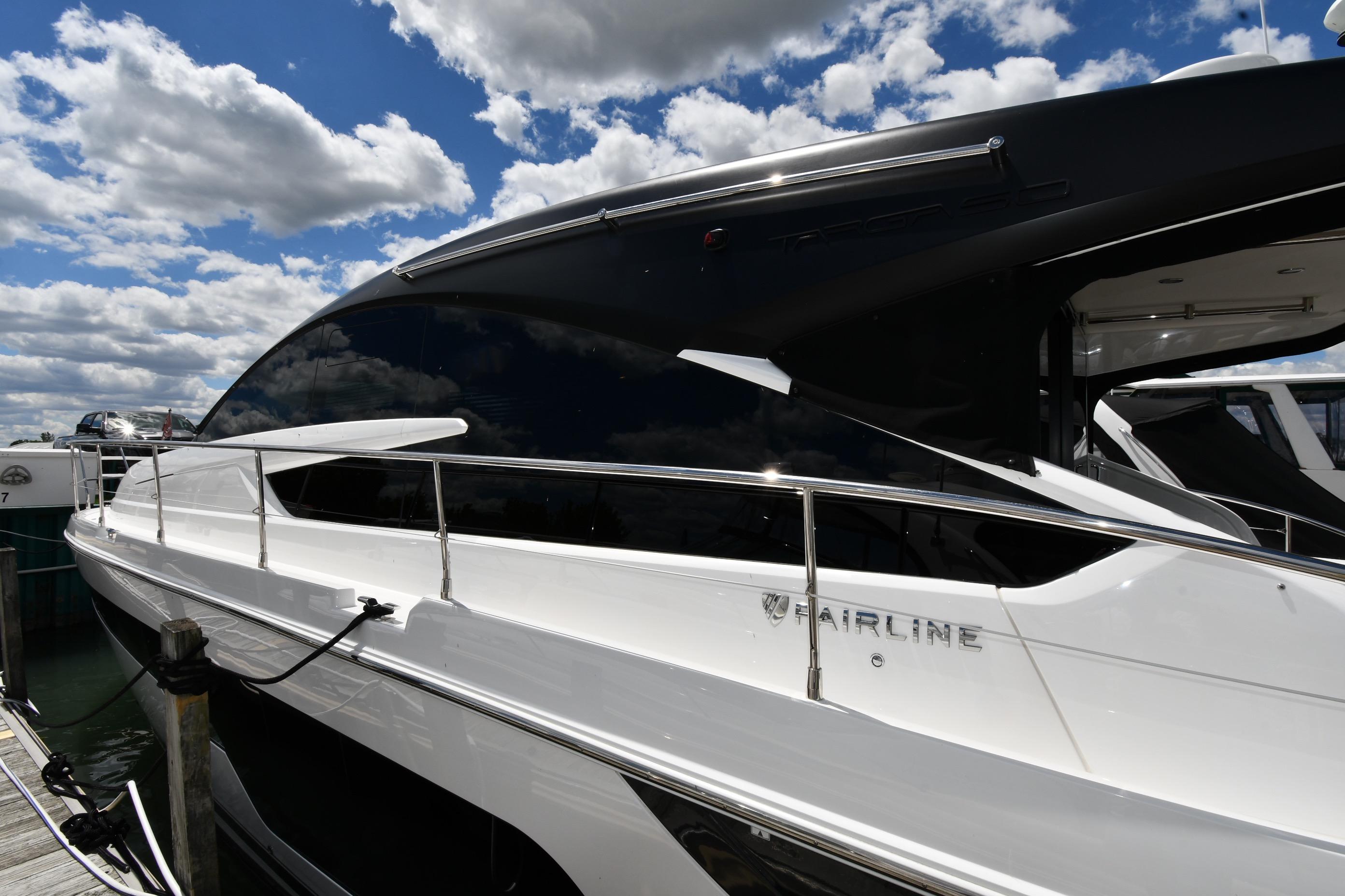 2024 Fairline G50 Targa yacht docked under a partly cloudy sky.