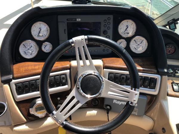 Dashboard of a 2008 Four Winns V338 with steering wheel and instruments.