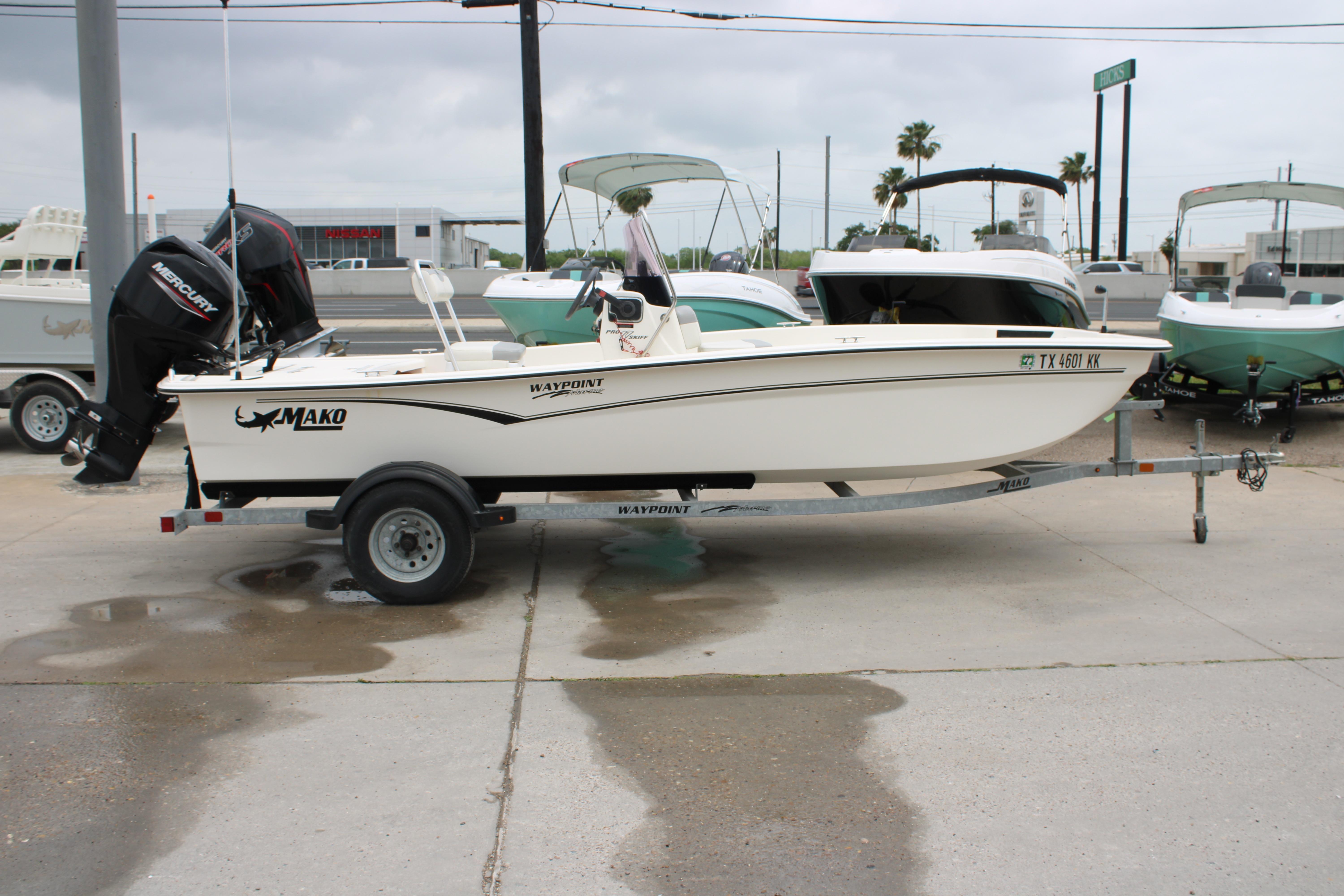 2021 Mako Pro Skiff 17 CC boat on trailer, parked outdoors.