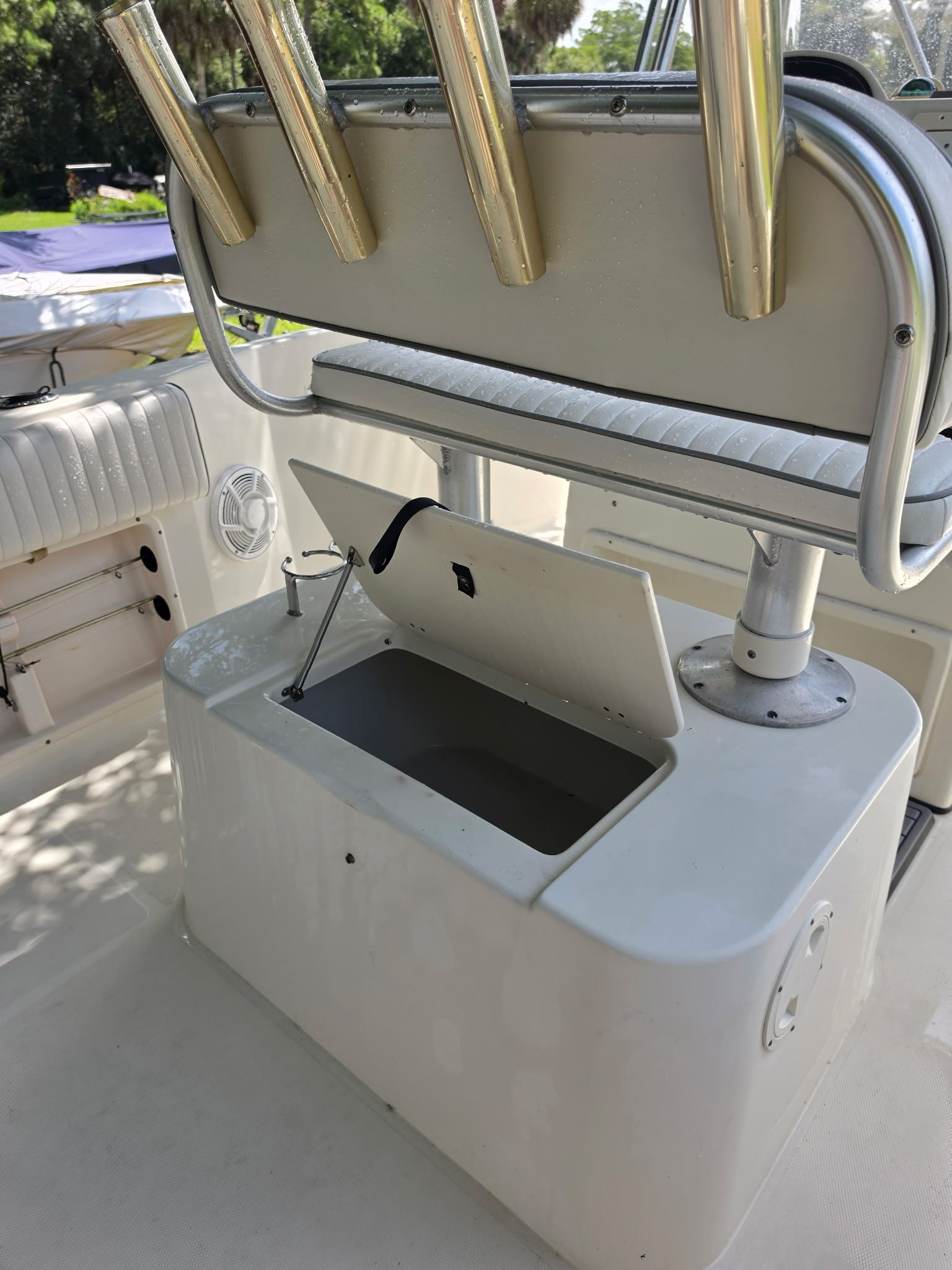 The image shows the interior of a 2004 Hydra-Sports Lightning 230 CC boat with an open storage compartment.