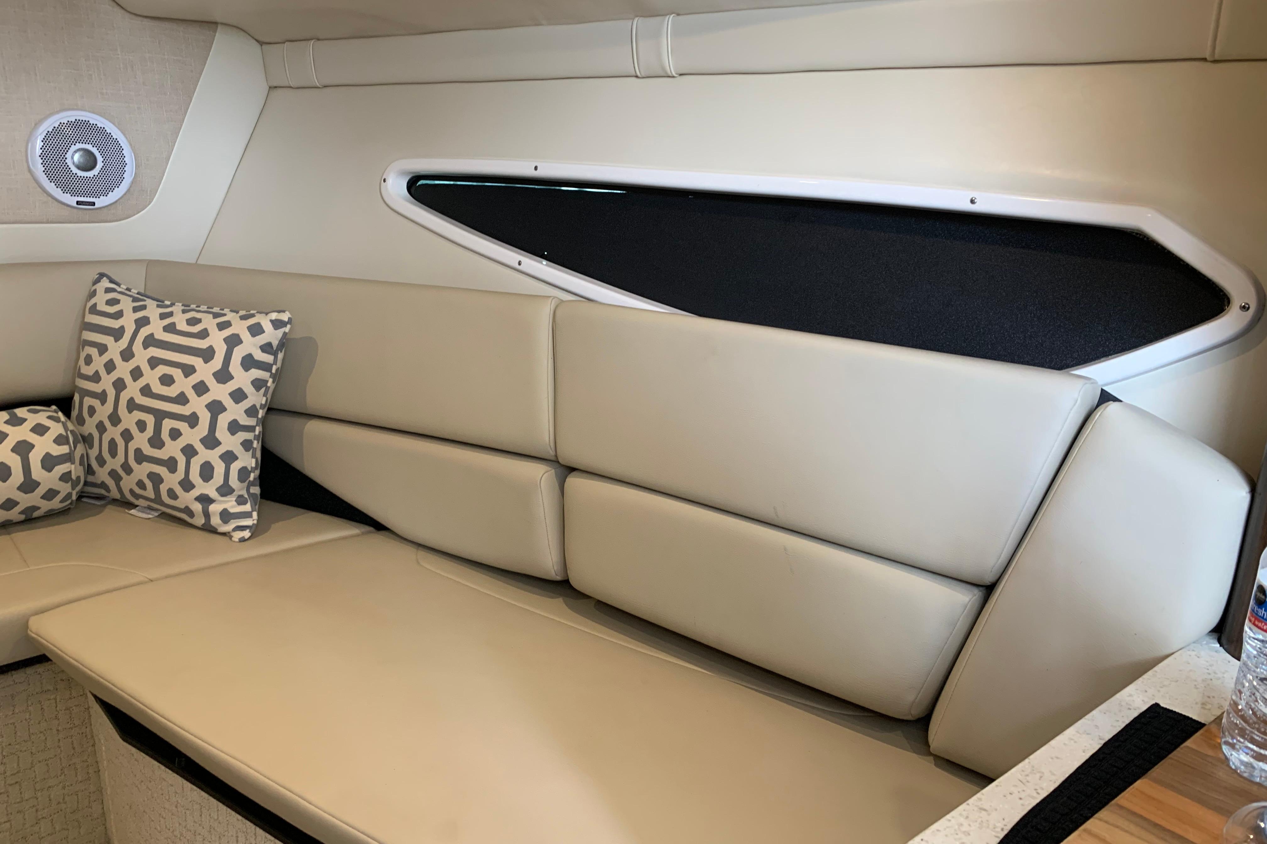 Interior of 2017 Regal 26 Express boat with beige seating and patterned cushions.