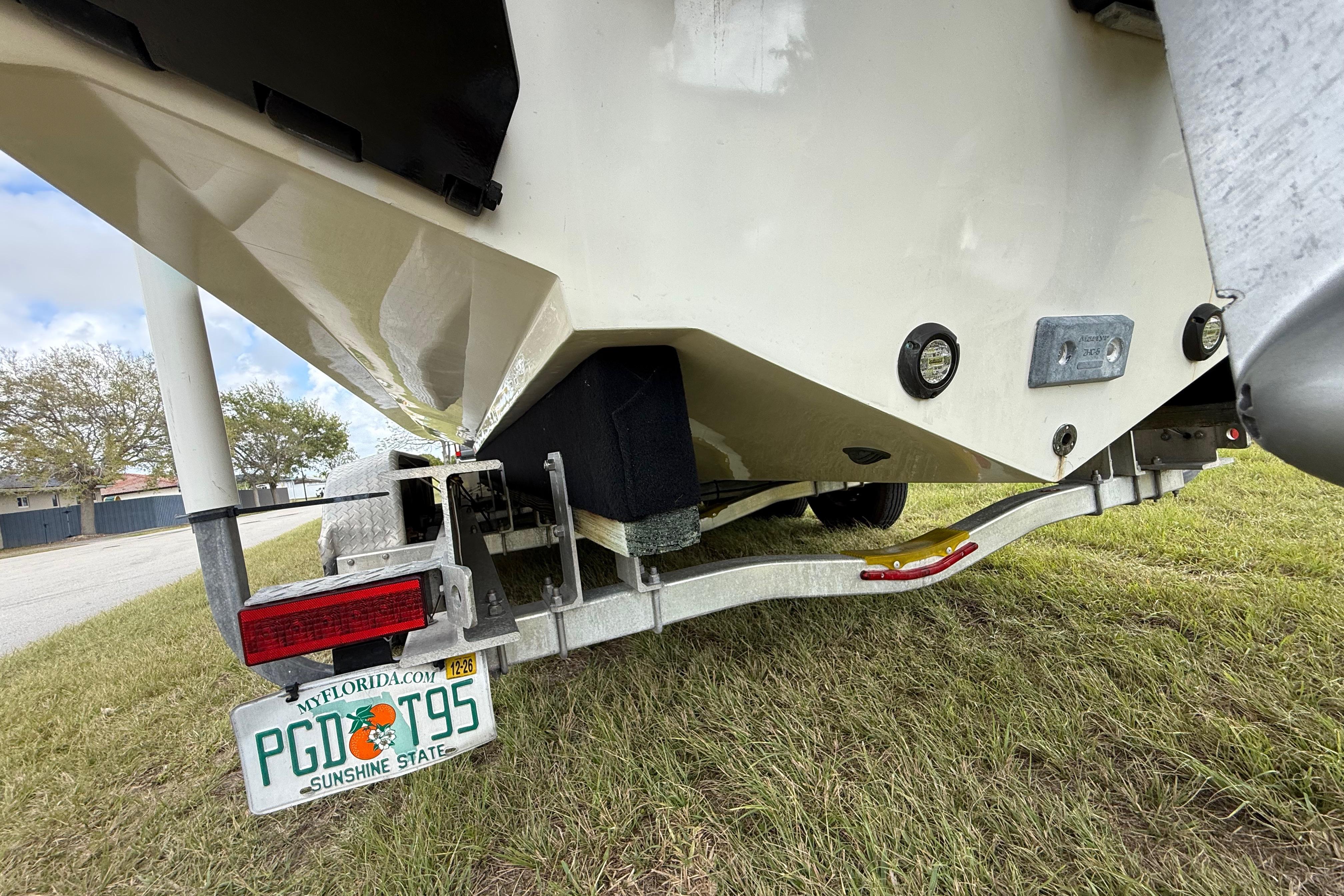 2016 Extreme Boats XC 38 Express on trailer, Florida license plate visible.