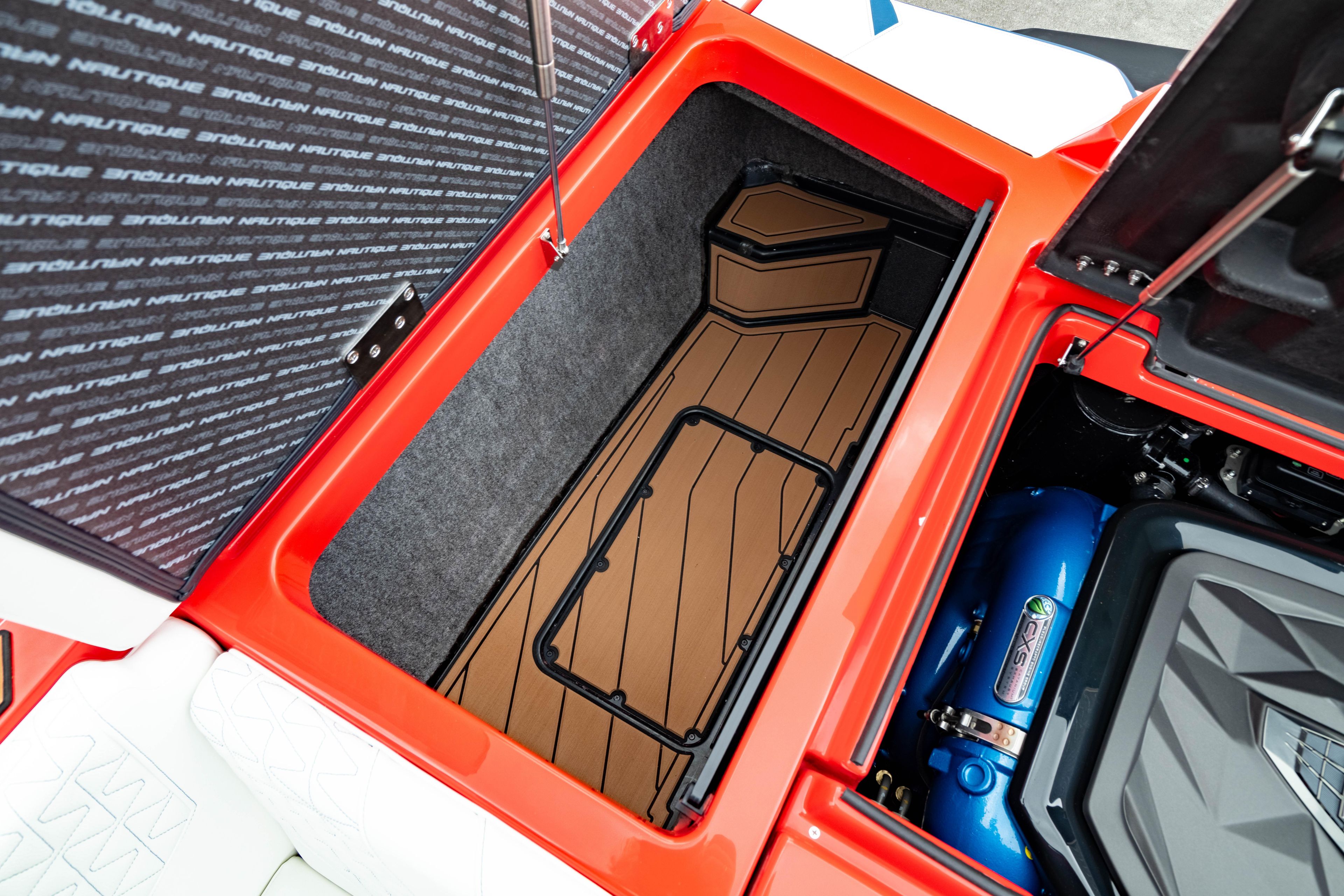 2025 Nautique Super Air Nautique GS20 storage compartment and engine detail.