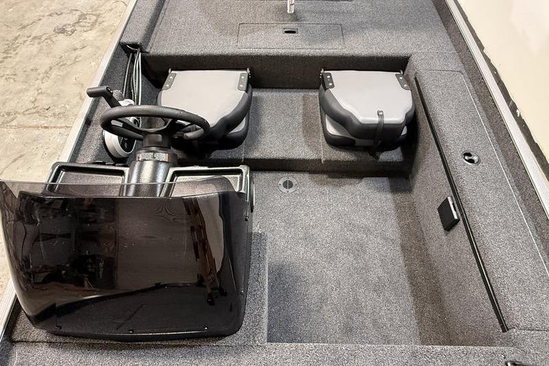2026 Lowe Skorpion 16 boat interior with steering wheel and dual seats.