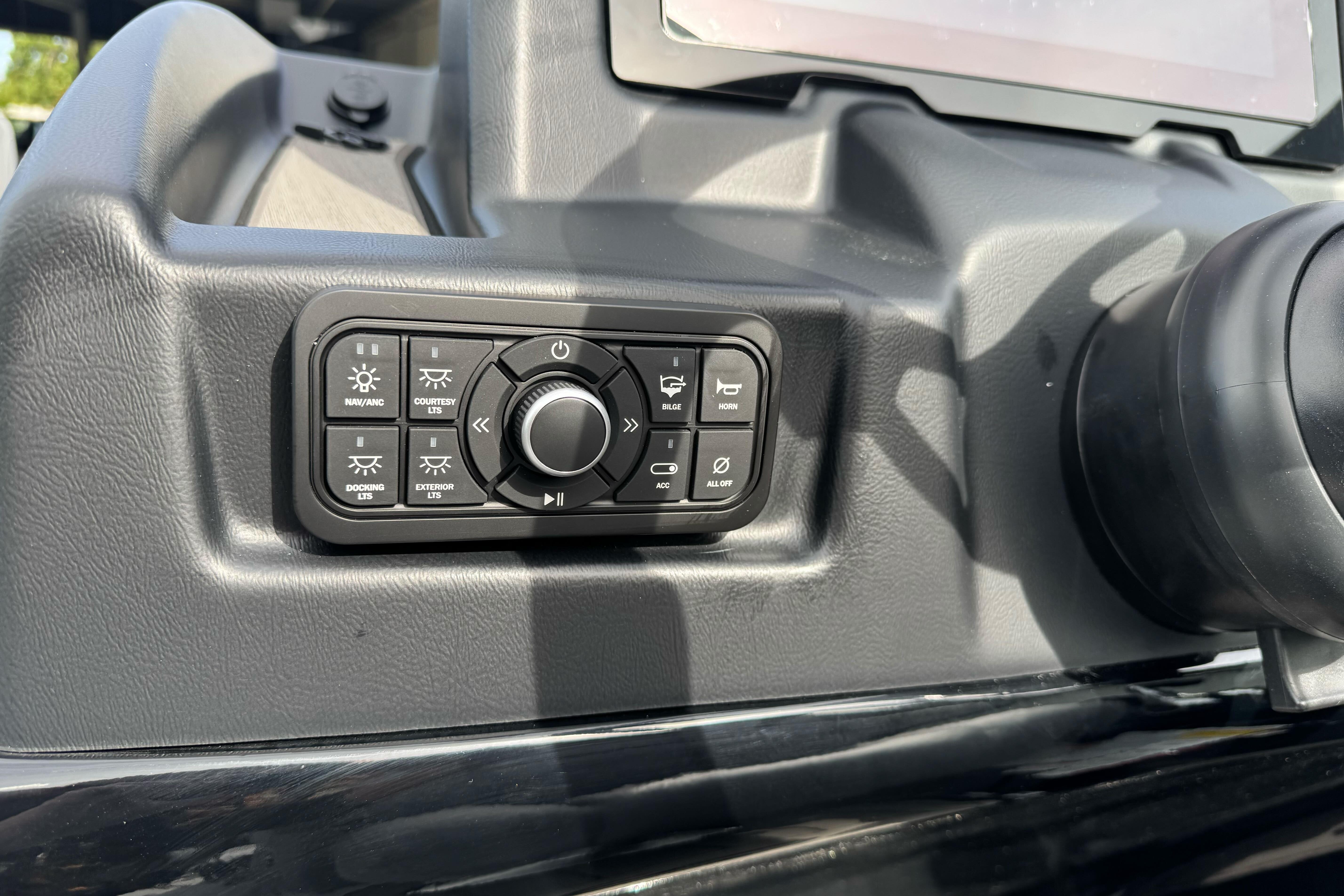 Control panel of a 2026 Regency 250 DL boat with various function buttons.