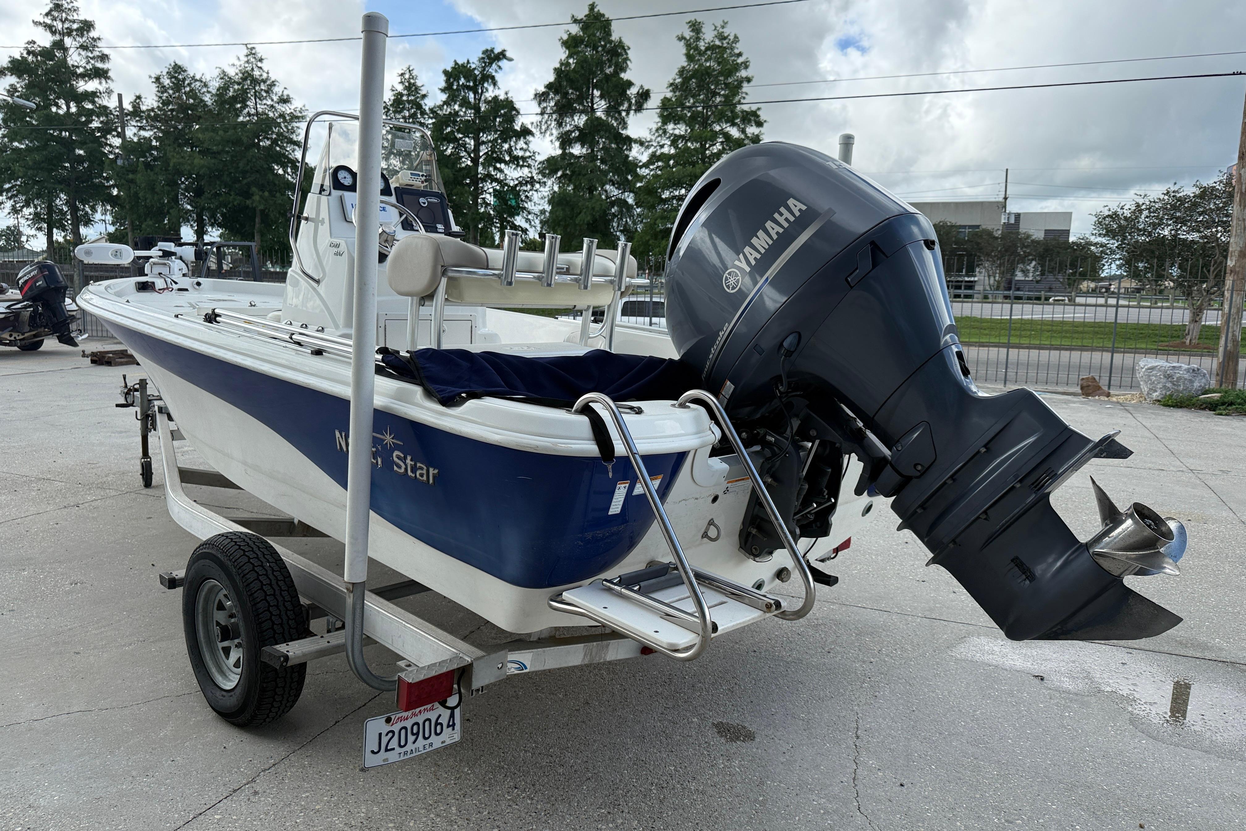 2017 NauticStar 1910 NauticBay boat with Yamaha outboard motor on trailer.