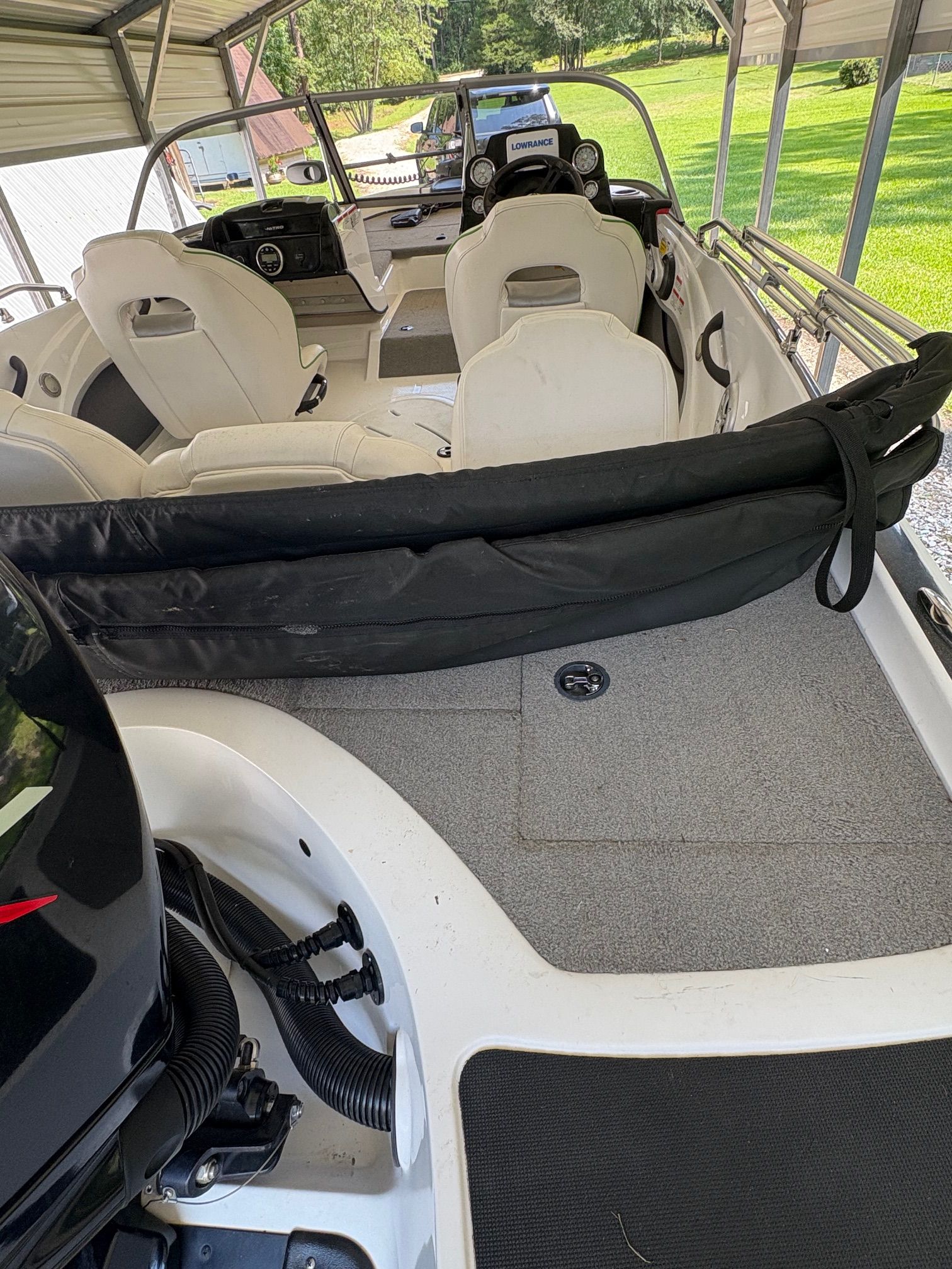 Interior view of a 2021 Nitro Z19 Sport boat with white seats and gray carpet.