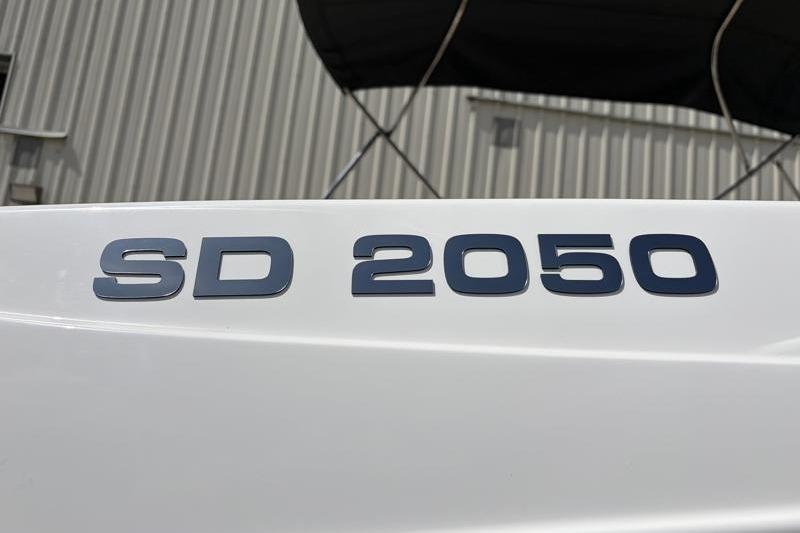 Close-up of 2026 Hurricane SunDeck Sport 2050 OB boat model lettering.